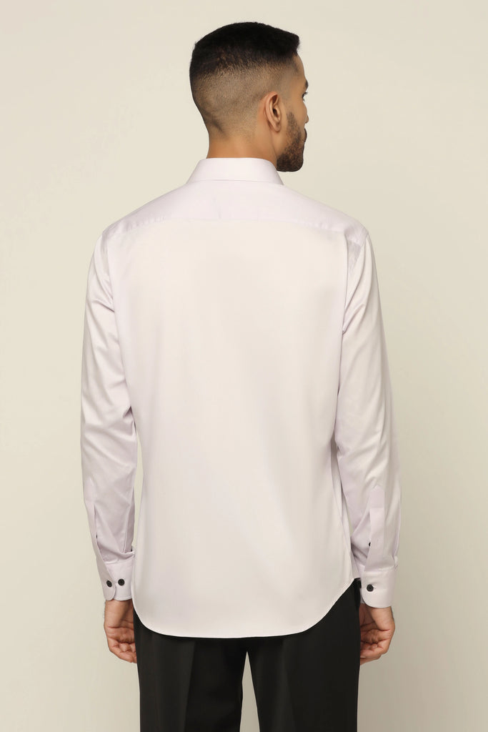 Crafted from 100% Giza cotton, this shirt showcases elegant contrast embroidery around the button placket for added flair.