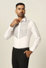 Crafted from non-crease white spun fabric, this shirt boasts intricate thread and cutdana embroidery across the chest and front. Perfectly paired with tuxedos for a polished look.