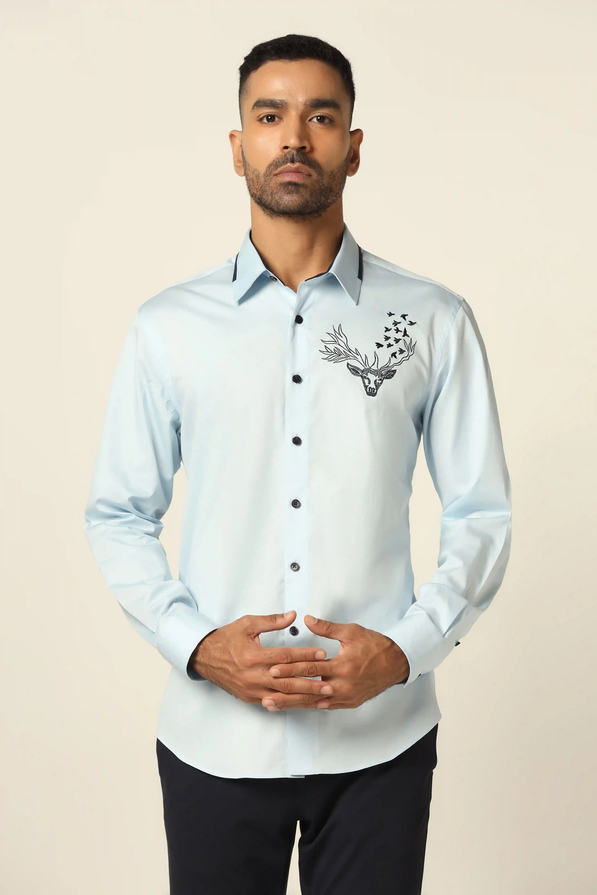 Add elegance to your wardrobe with our stunning blue designer shirt. Shop Now!
