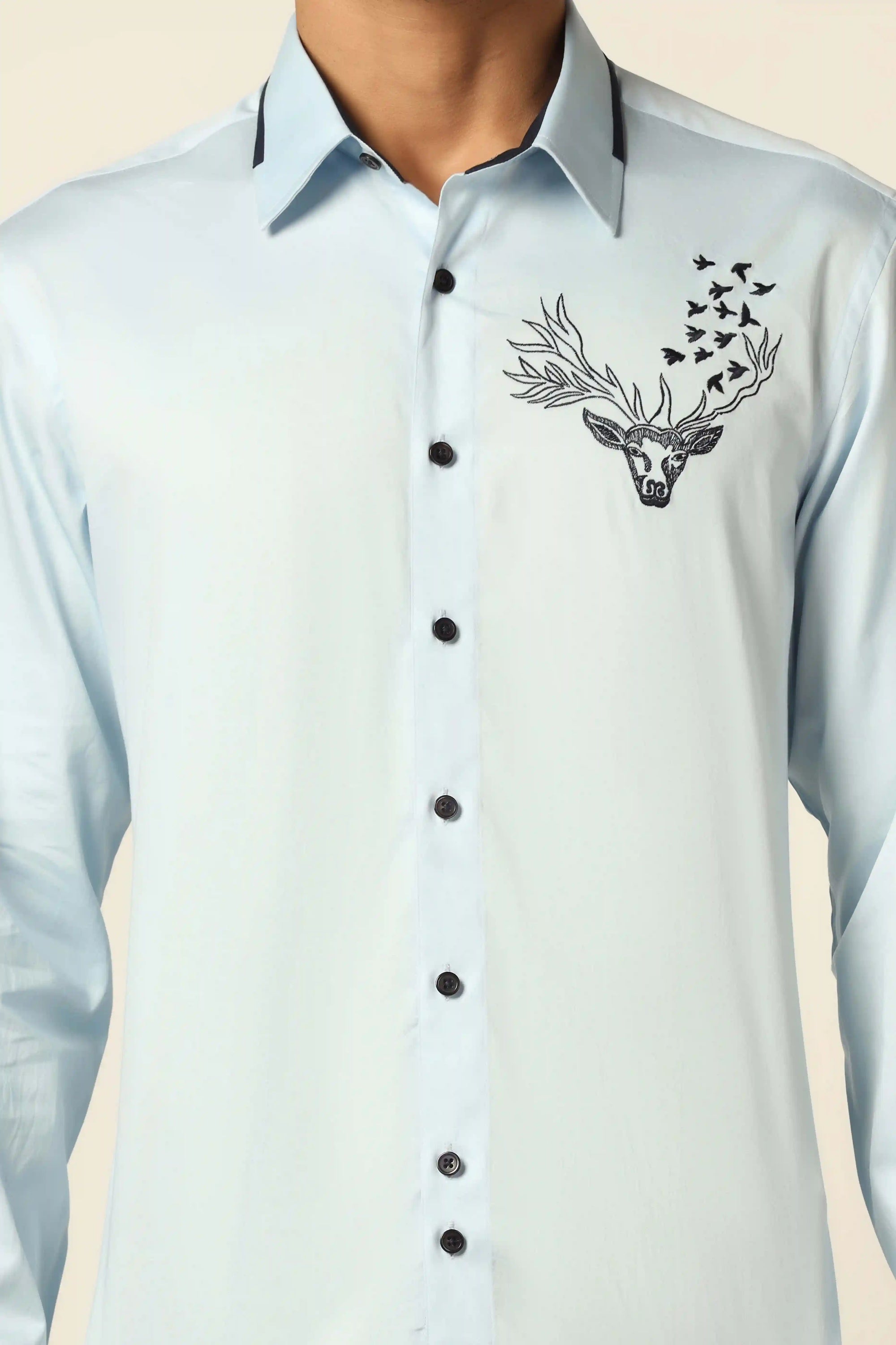 Add elegance to your wardrobe with our stunning blue designer shirt. Shop Now!