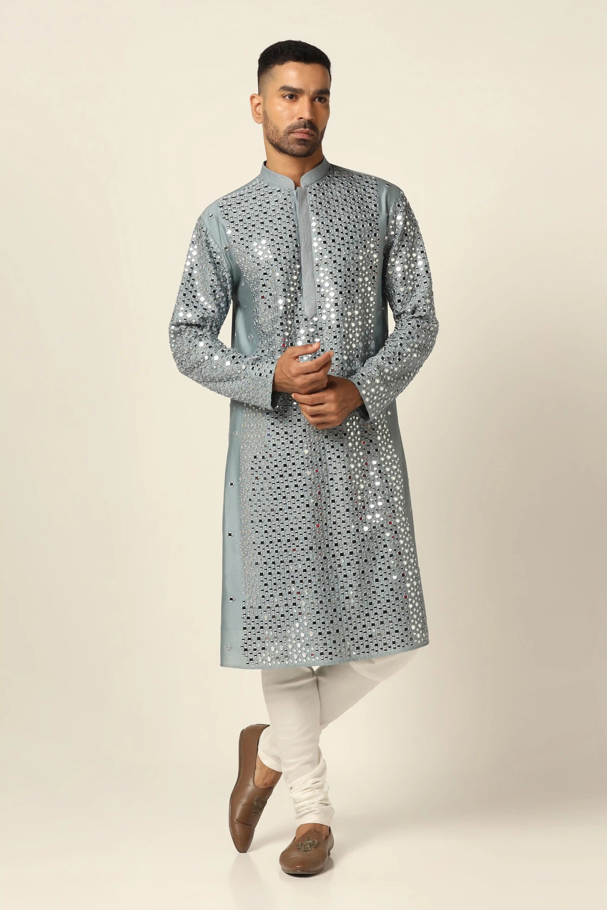 This Chanderi silk Kurta Pajama set features elegant mirror work and thread embroidery. Shop Now!
