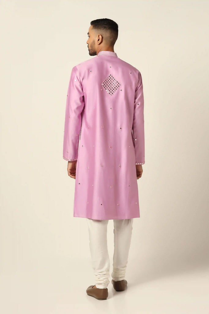 Elevate your style with mirrorwork magic. This Chanderi silk Kurta features intricate mirrorwork embroidery, paired perfectly with off-white pajamas.