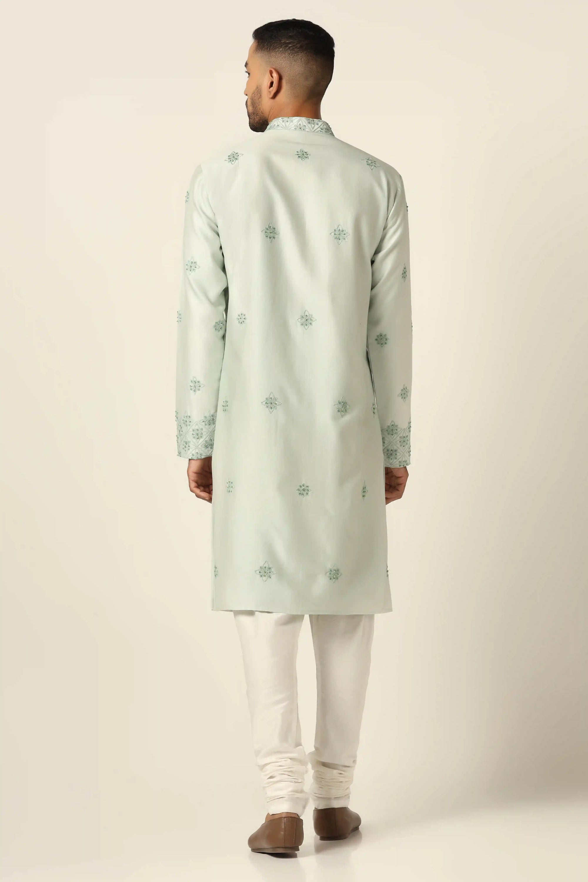 Floral thread embroidery adorns this kurta with off-white pajamas for a timeless ensemble. Shop Now!