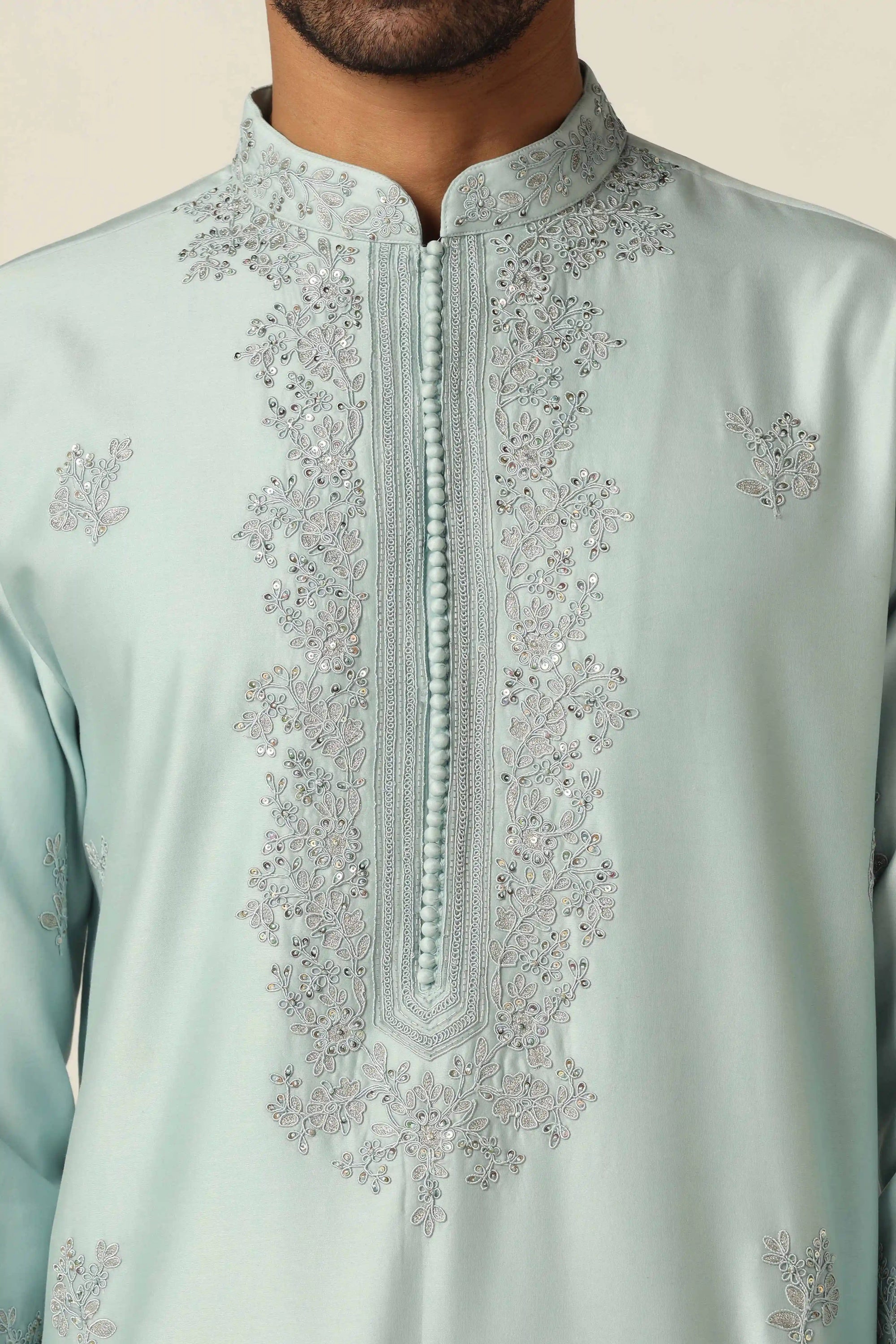 This Chanderi Silk kurta set exudes elegance with its intricate thread embroidery. Shop Now!