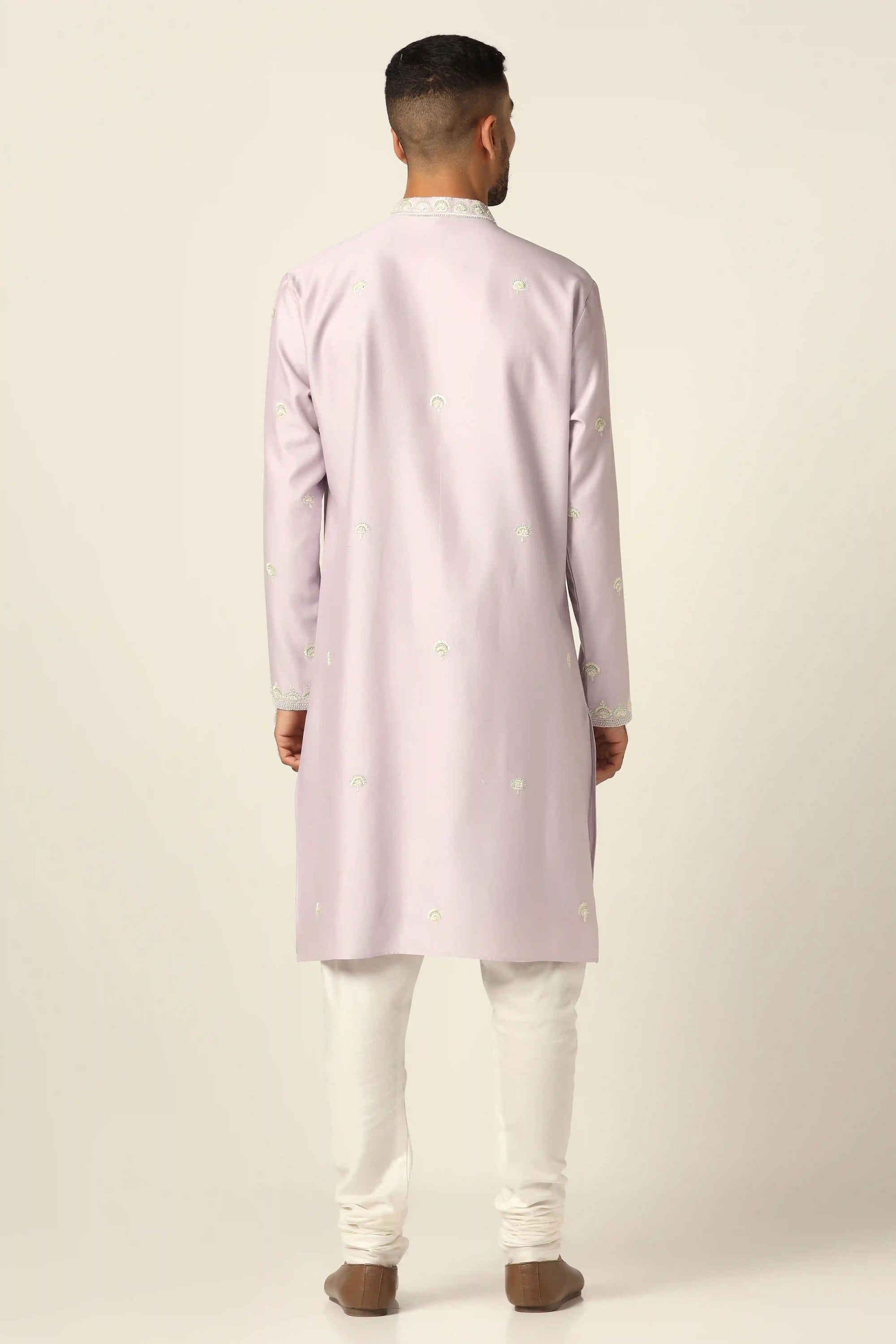 Experience our chanderi silk Kurta set, adorned with intricate thread/machine embroidery. Shop Now!