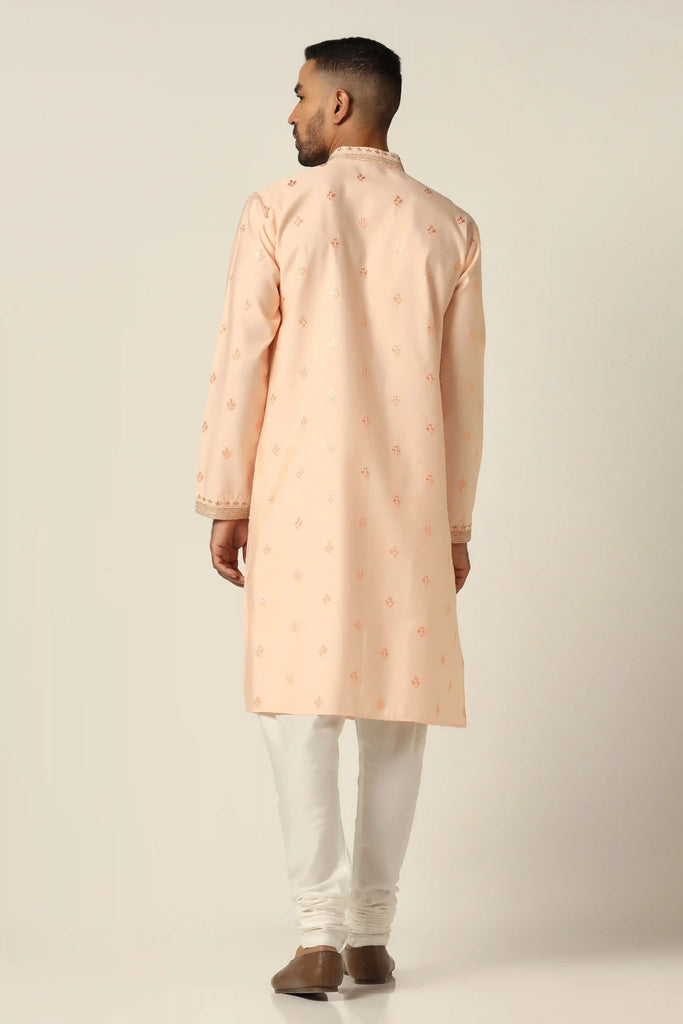Elevate your style with our thread-embroidered Kurta paired with matching off-white pajamas for a timeless ensemble."