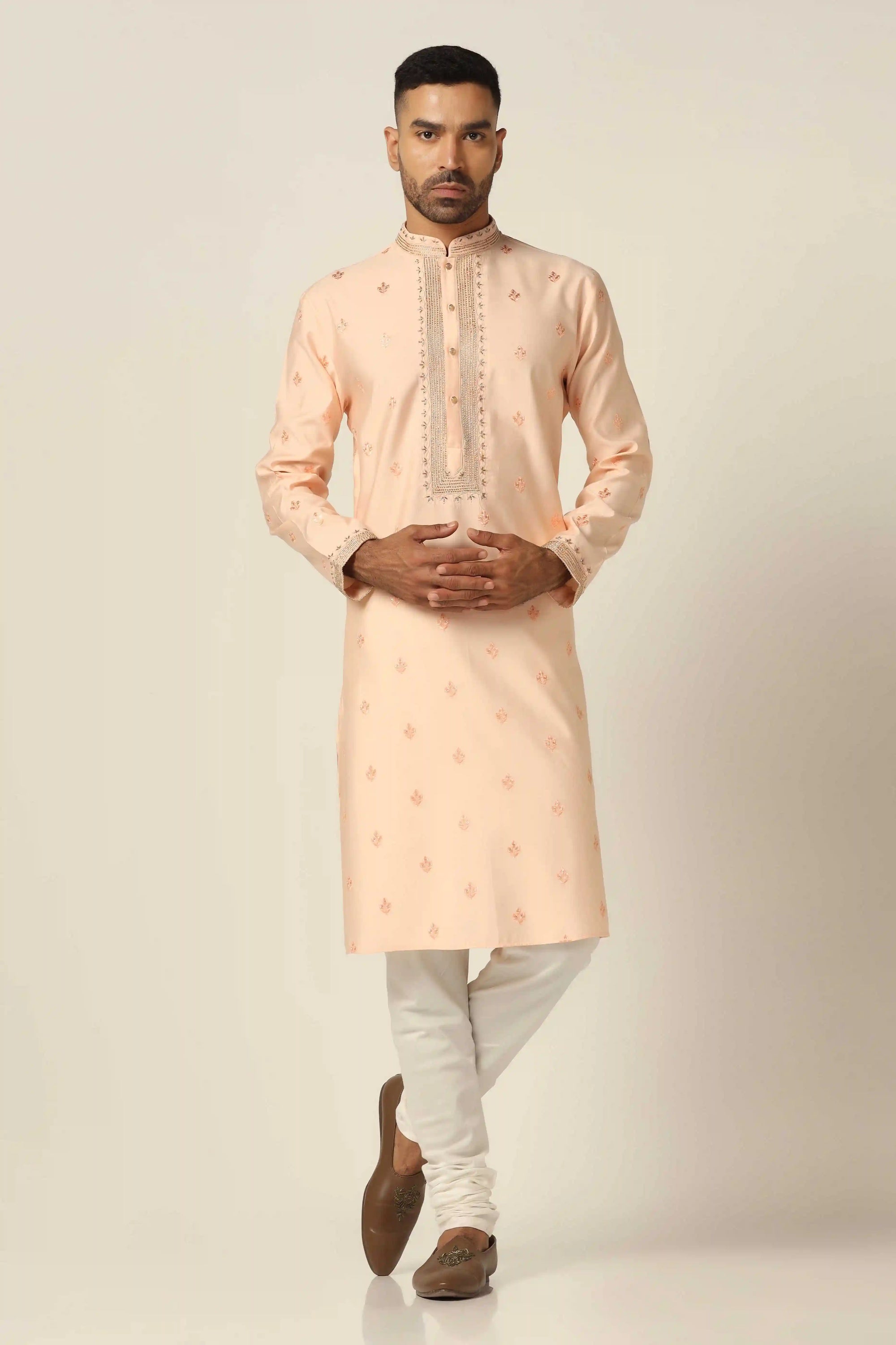 Elevate your style with thread-embroidered Kurta paired with matching off-white pajamas. Shop Now!