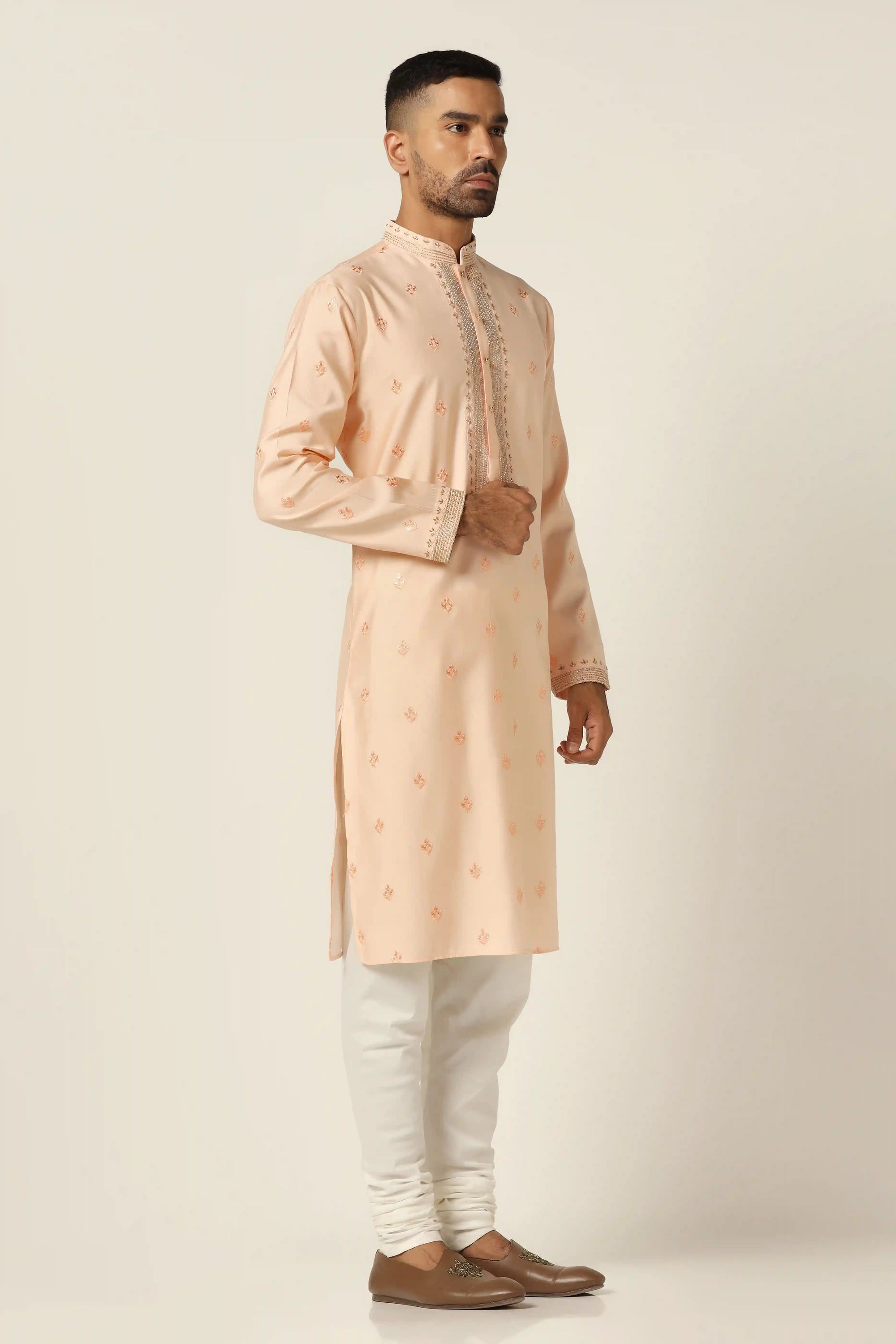 Elevate your style with thread-embroidered Kurta paired with matching off-white pajamas. Shop Now!
