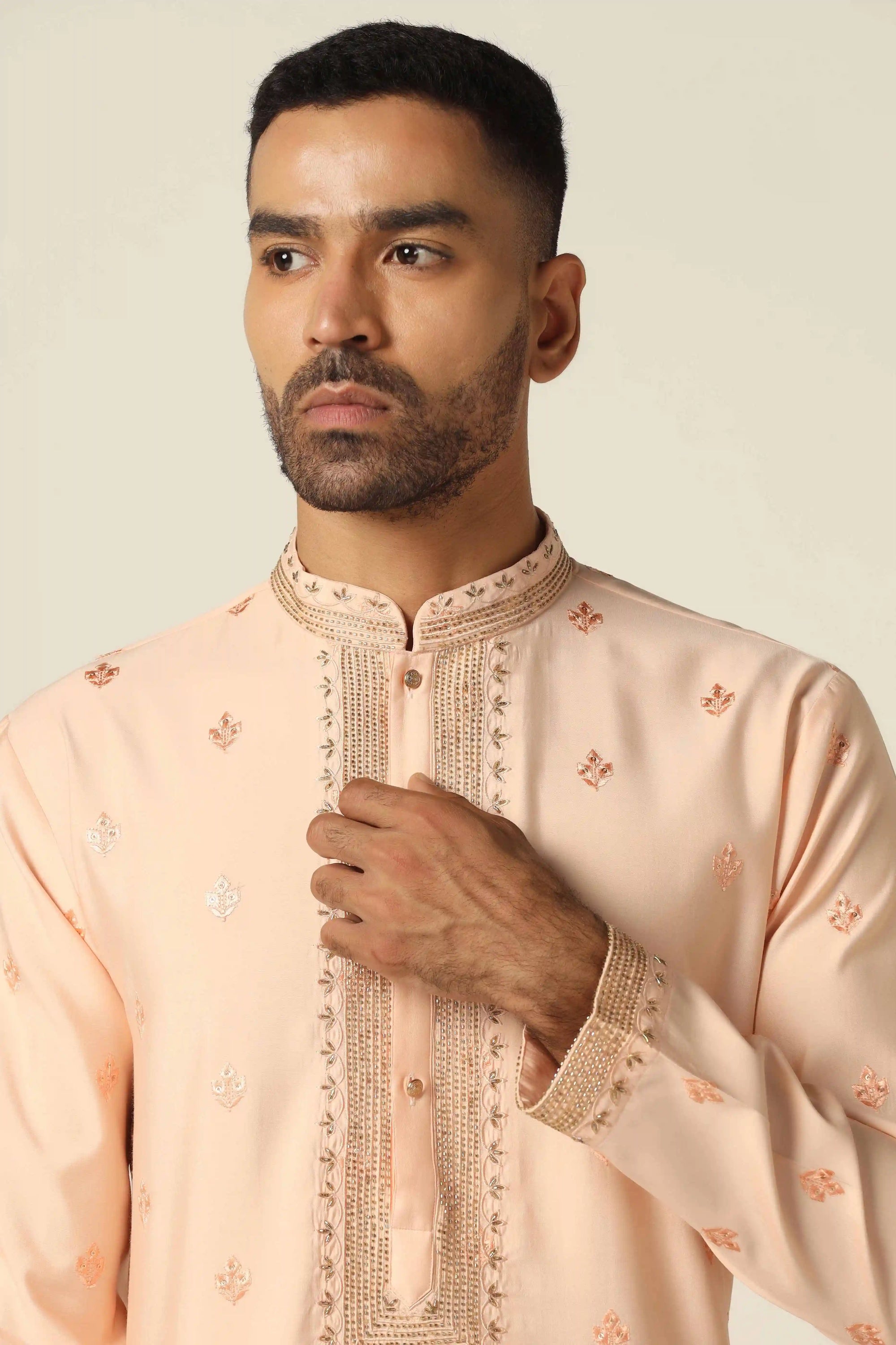 Elevate your style with thread-embroidered Kurta paired with matching off-white pajamas. Shop Now!
