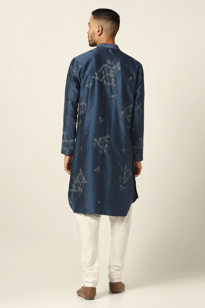 Dress in elegance with our Navy Kurta, adorned with floral thread embroidery. Featuring a front open design, paired perfectly with matching off-white pajamas.