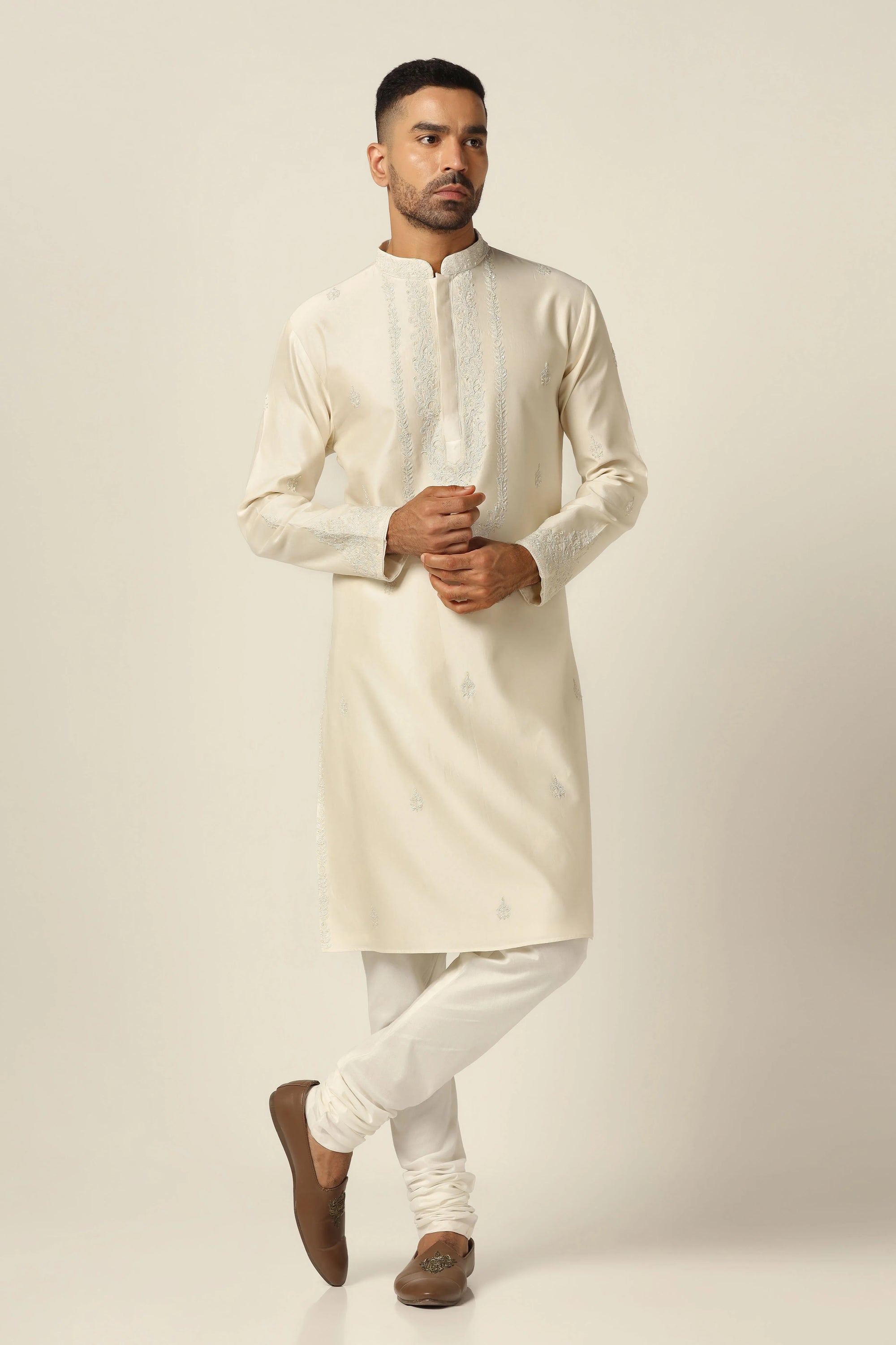Crafted from Chanderi silk, this kurta pajama set boasts tonal thread embroidery. Shop Now!