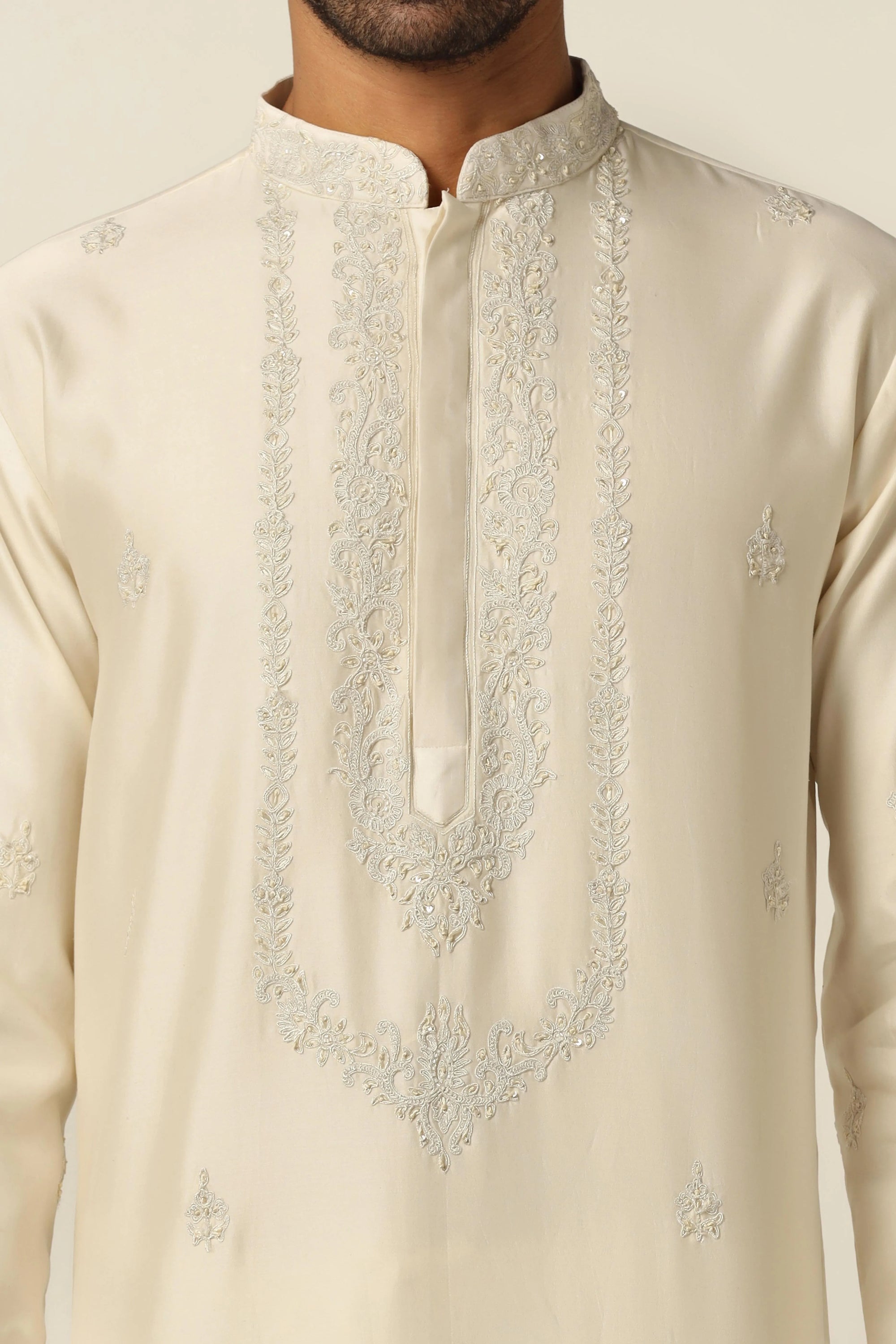 Crafted from Chanderi silk, this kurta pajama set boasts tonal thread embroidery. Shop Now!