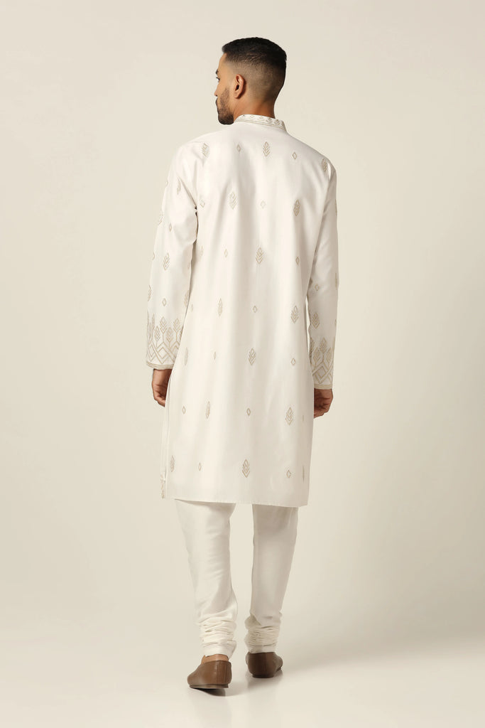 Elevate your ethnic style with this kurta featuring tonal thread embroidery. Paired with matching off-white pajamas for a refined ensemble.