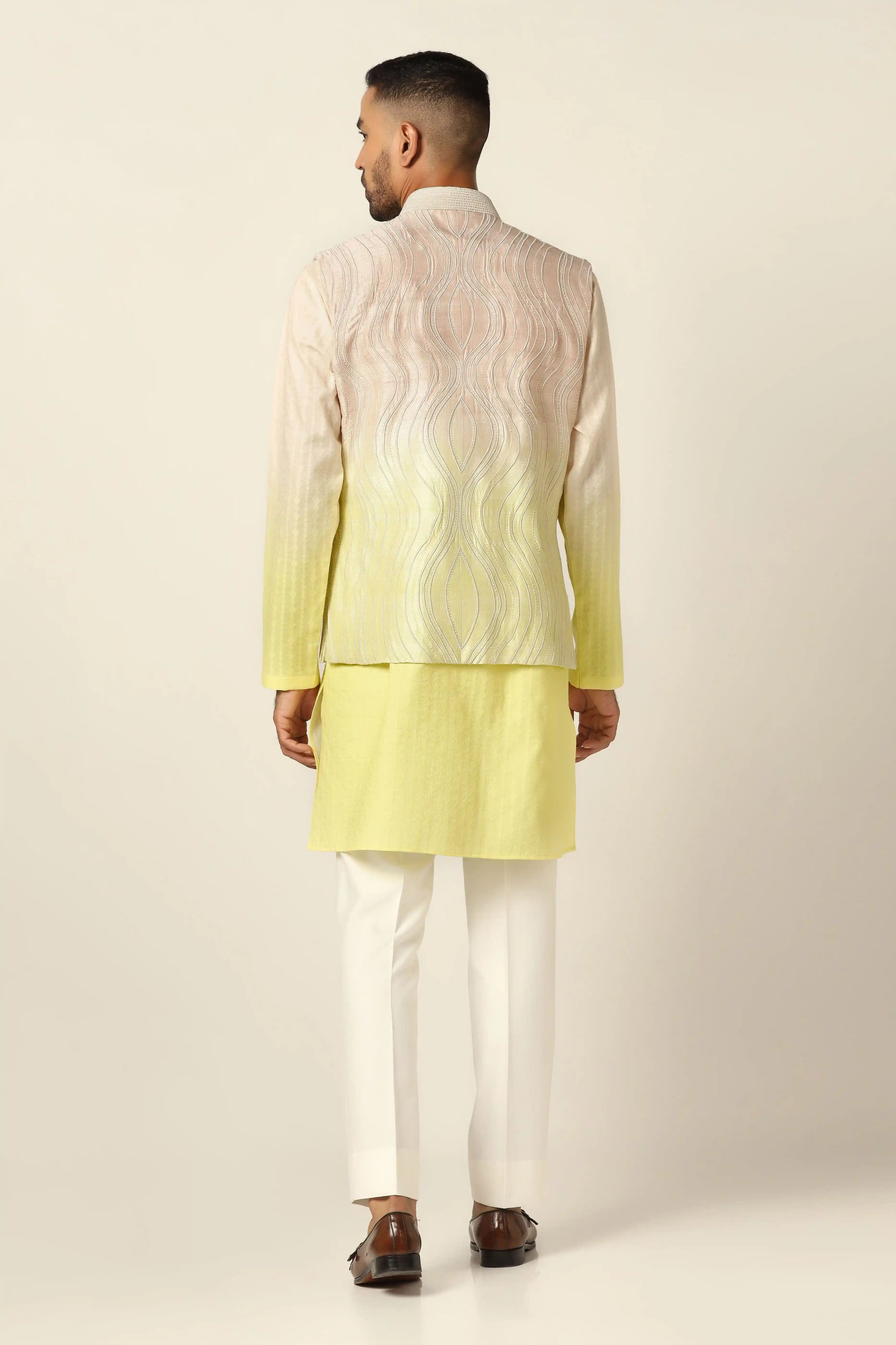 Indulge in elegance with our embroidered Nehru Jacket set, blending yellow and peach hues. Shop Now!