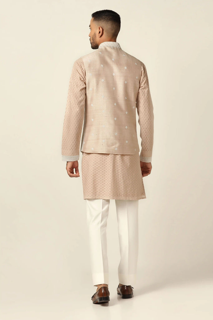 Experience the fusion of machine & hand embroidery in our Nehru Jacket set. Paired with a matching kurta and white trousers for refined elegance.