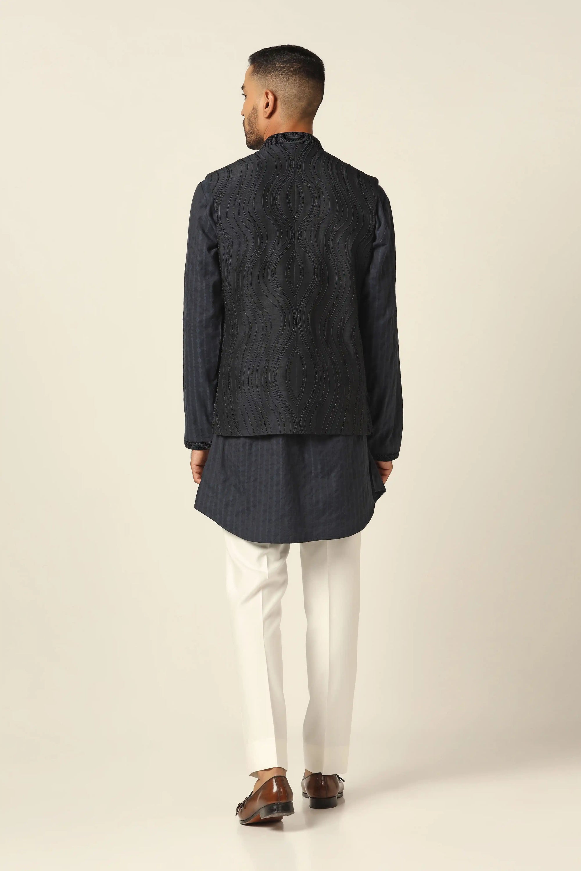 Add elegance to your wardrobe with the Navy Jacket featuring beautiful embroidery. Shop now!