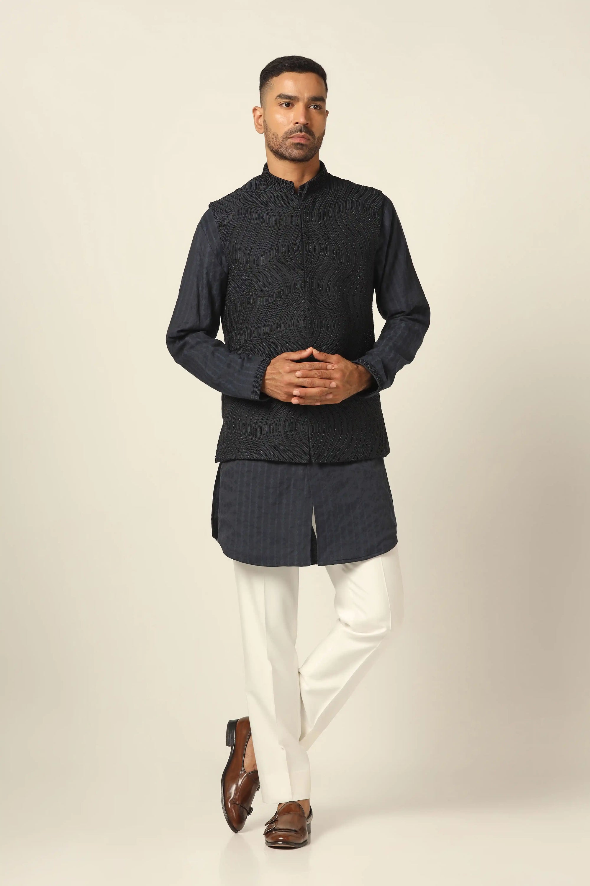Add elegance to your wardrobe with the Navy Jacket featuring beautiful embroidery. Shop now!