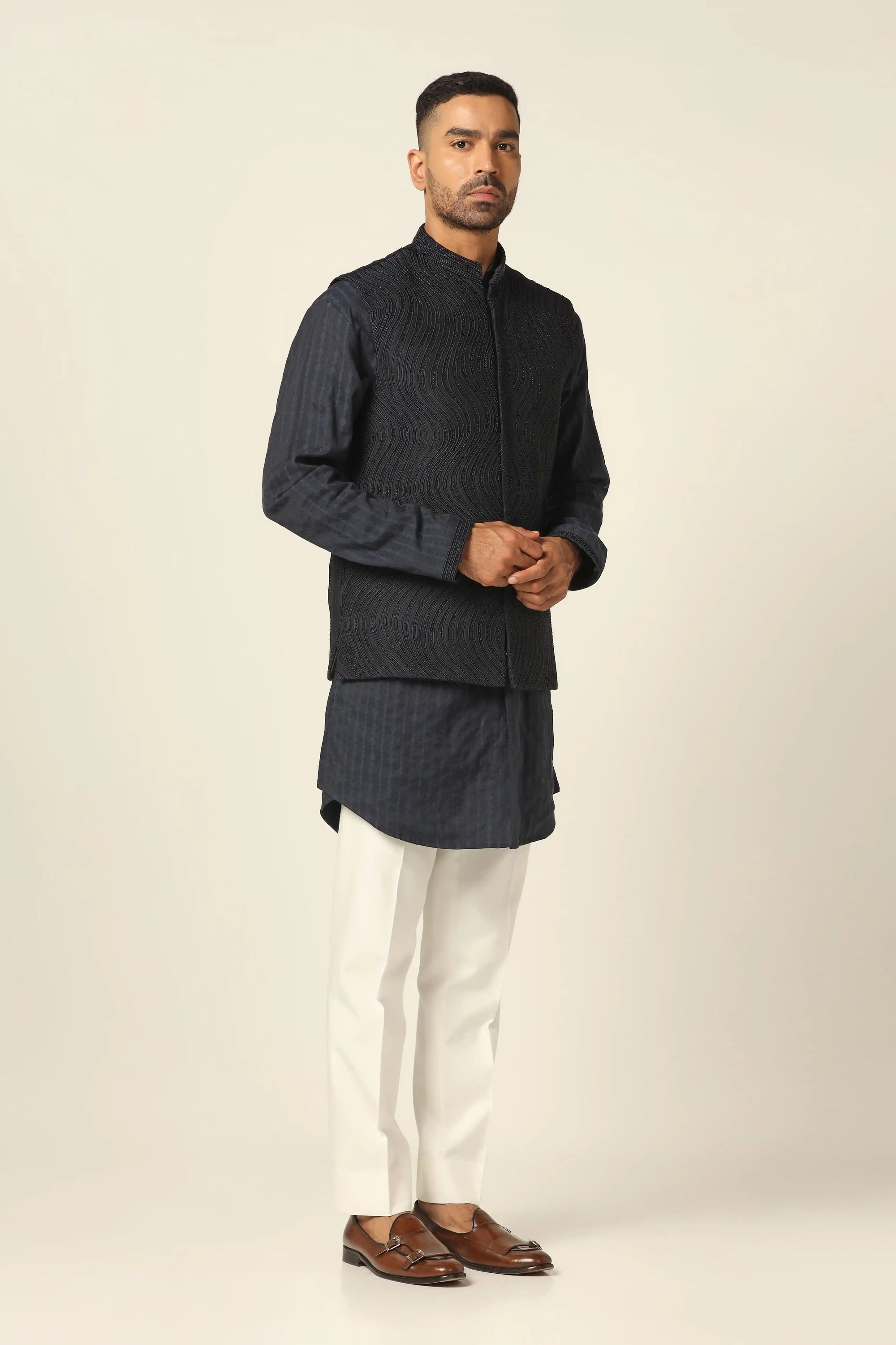 Add elegance to your wardrobe with the Navy Jacket featuring beautiful embroidery. Shop now!