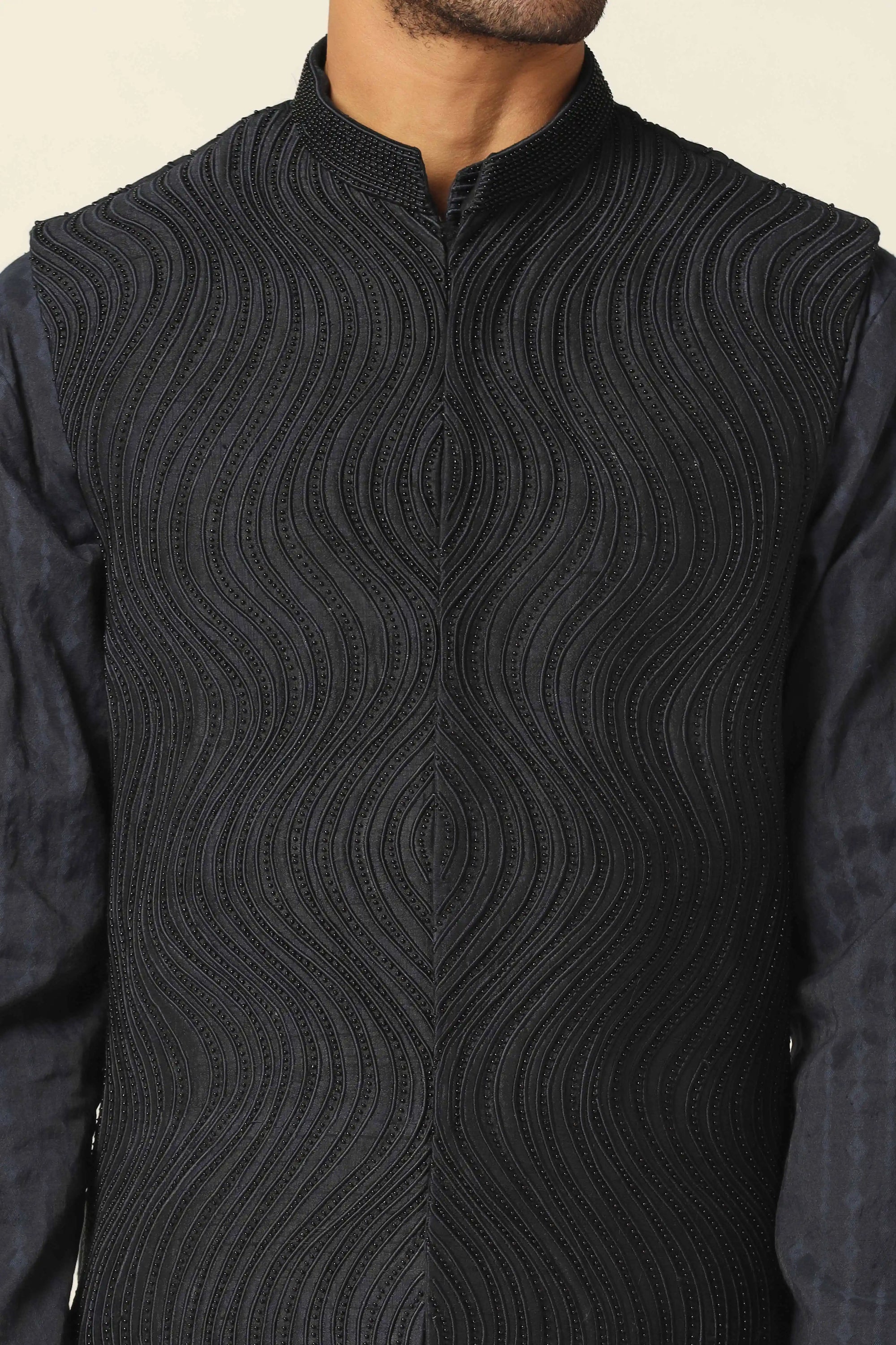 Add elegance to your wardrobe with the Navy Jacket featuring beautiful embroidery. Shop now!