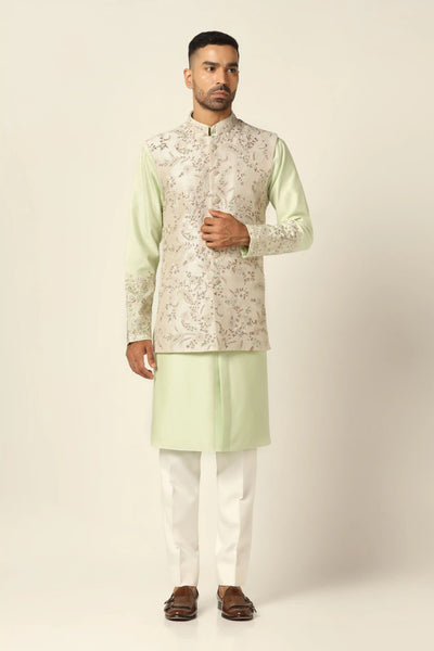 Elevate your look with our Nehru Jacket adorned with floral embroidery. Paired seamlessly with a matching kurta and white pajamas for timeless style.