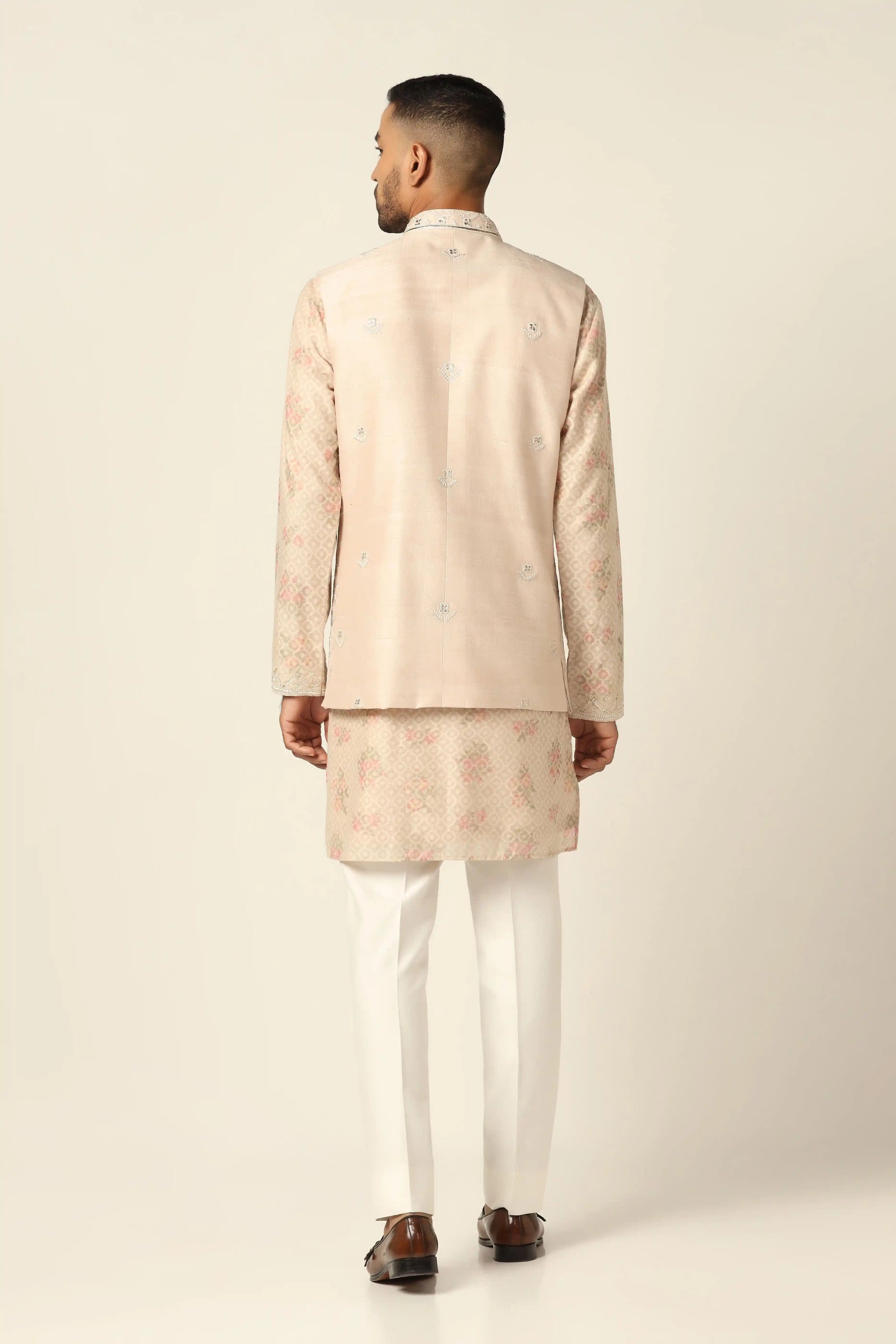 Add elegance to your wardrobe with the Peach Jacket Set featuring beautiful embroidery. Shop now!