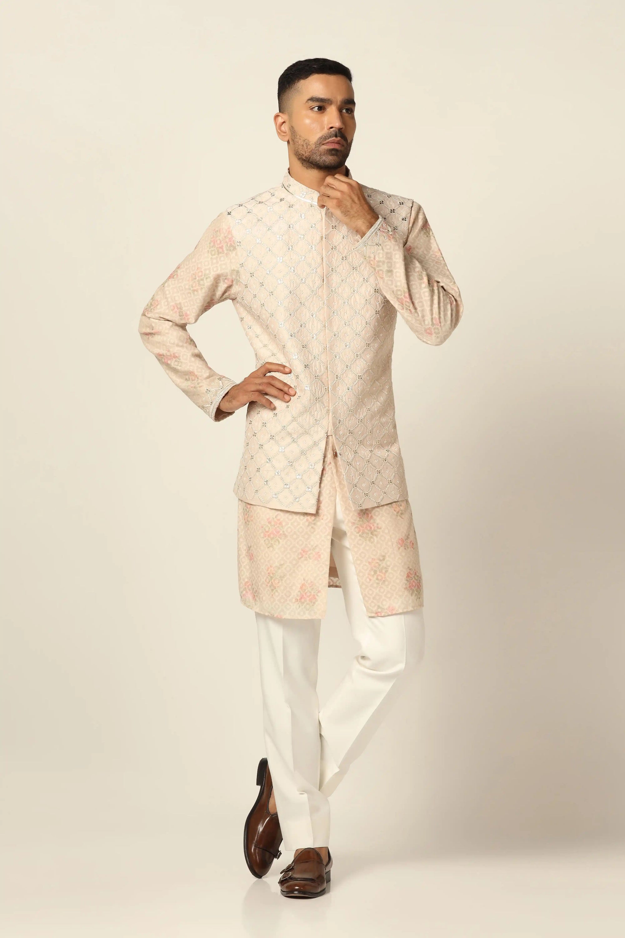 Add elegance to your wardrobe with the Peach Jacket Set featuring beautiful embroidery. Shop now!