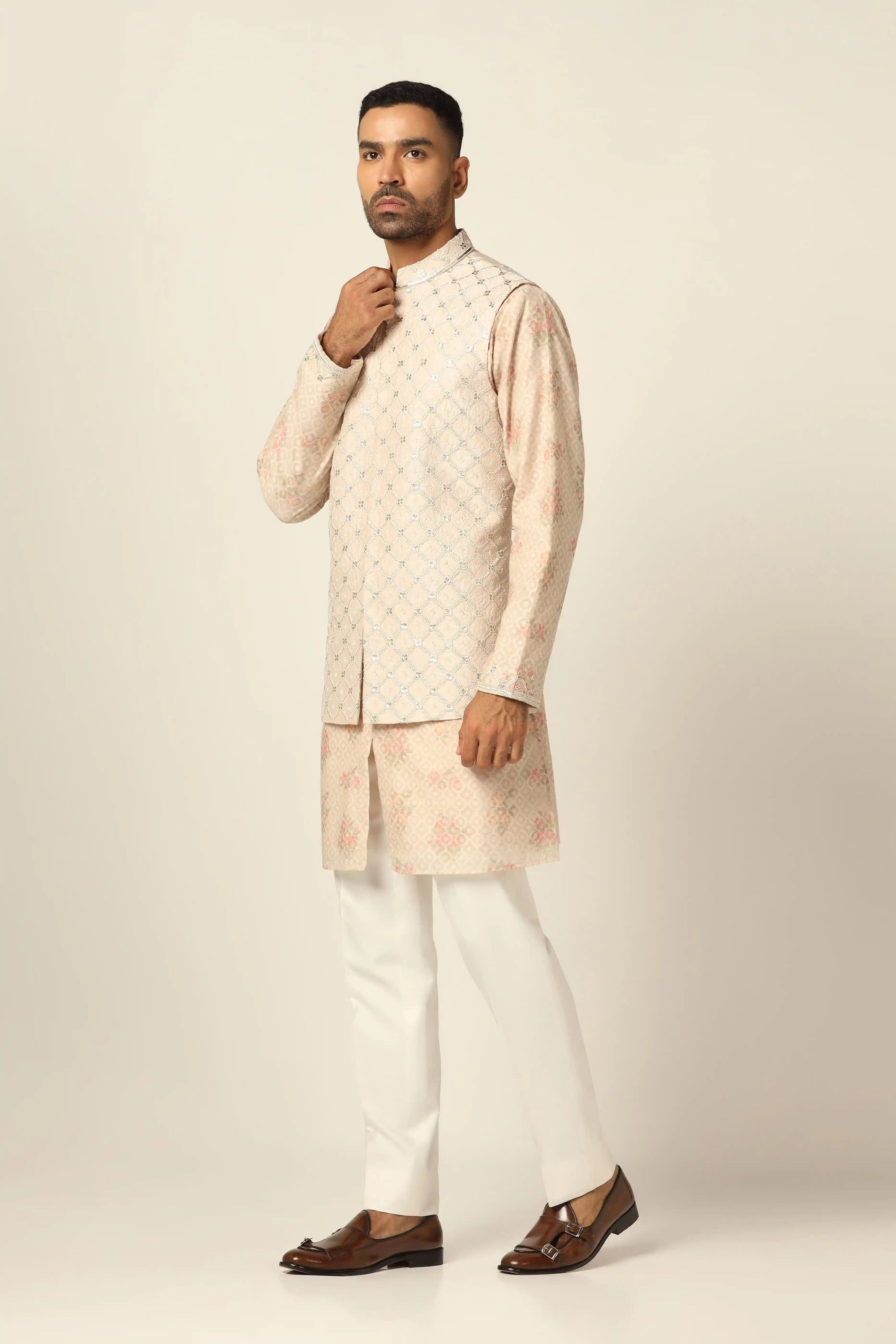 Add elegance to your wardrobe with the Peach Jacket Set featuring beautiful embroidery. Shop now!