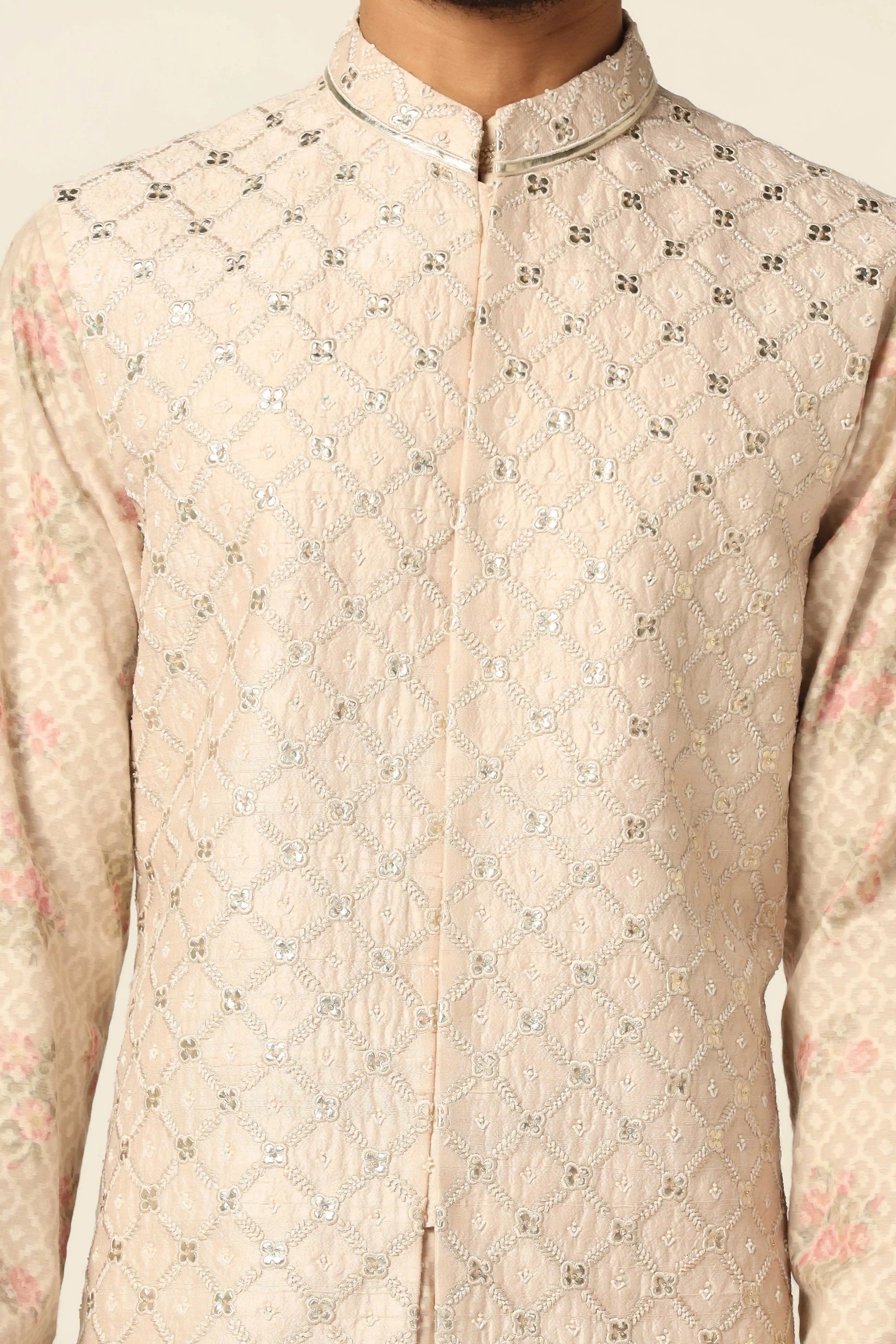 Add elegance to your wardrobe with the Peach Jacket Set featuring beautiful embroidery. Shop now!