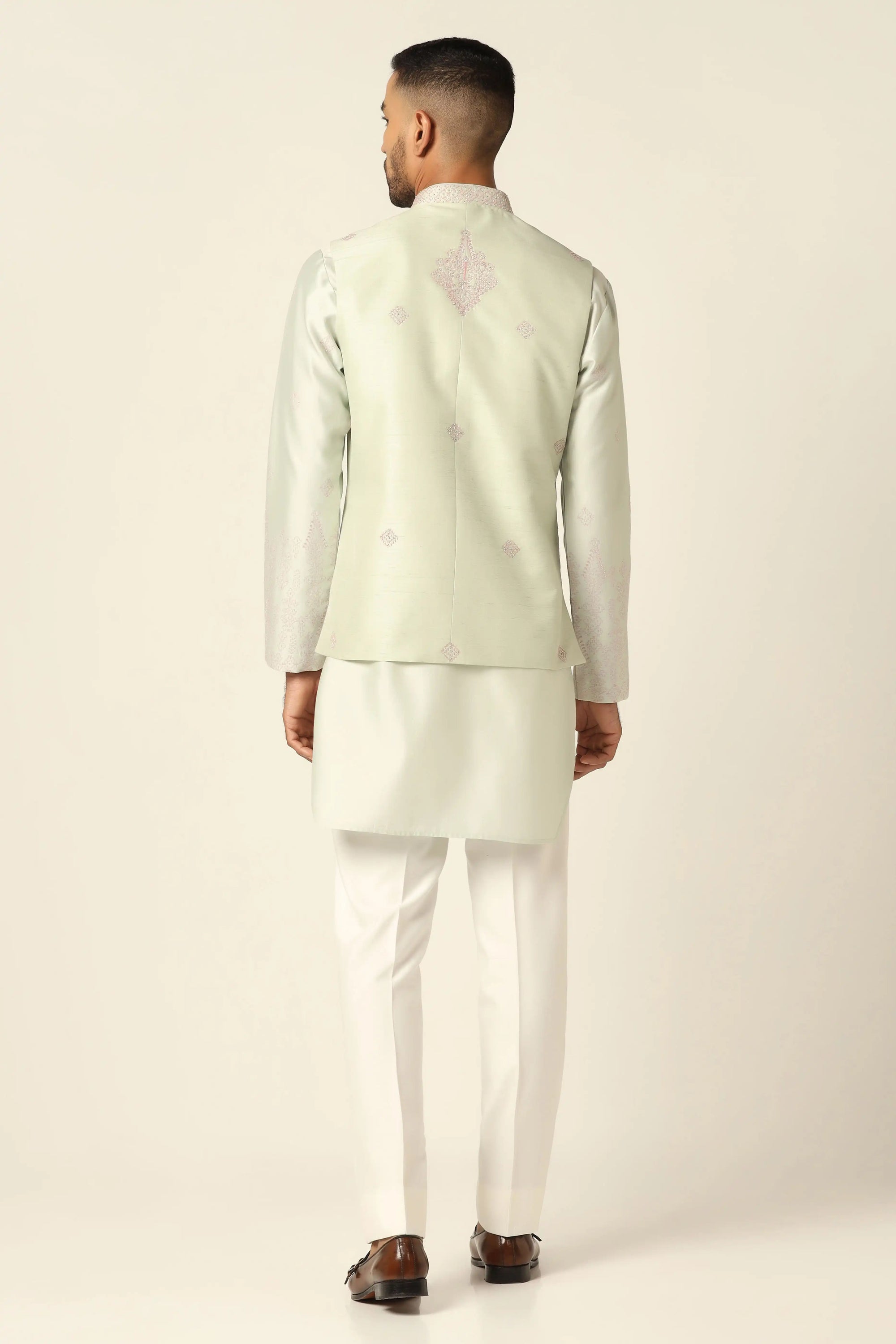 Redefine style with the Green Nehru Set adorned with intricate mirror embroidery. Shop Now!