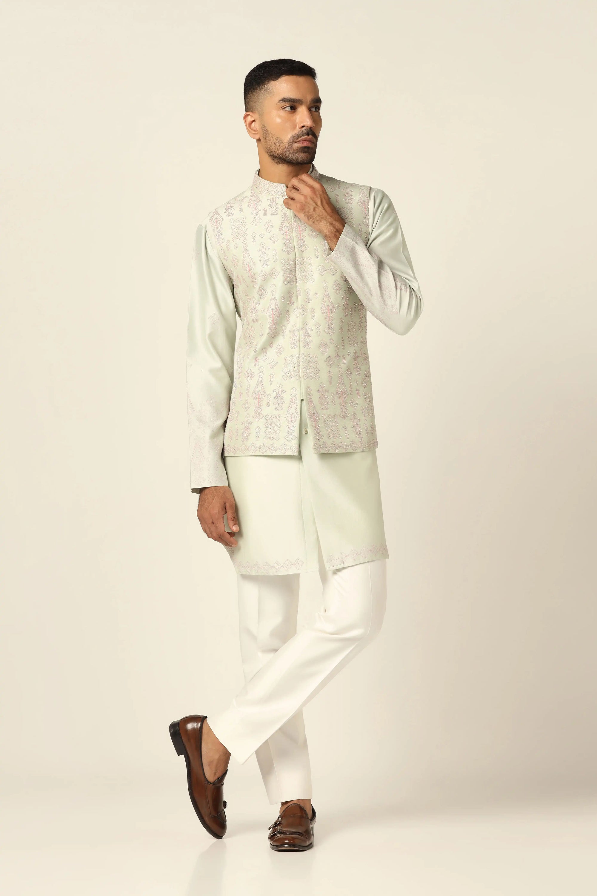 Redefine style with the Green Nehru Set adorned with intricate mirror embroidery. Shop Now!