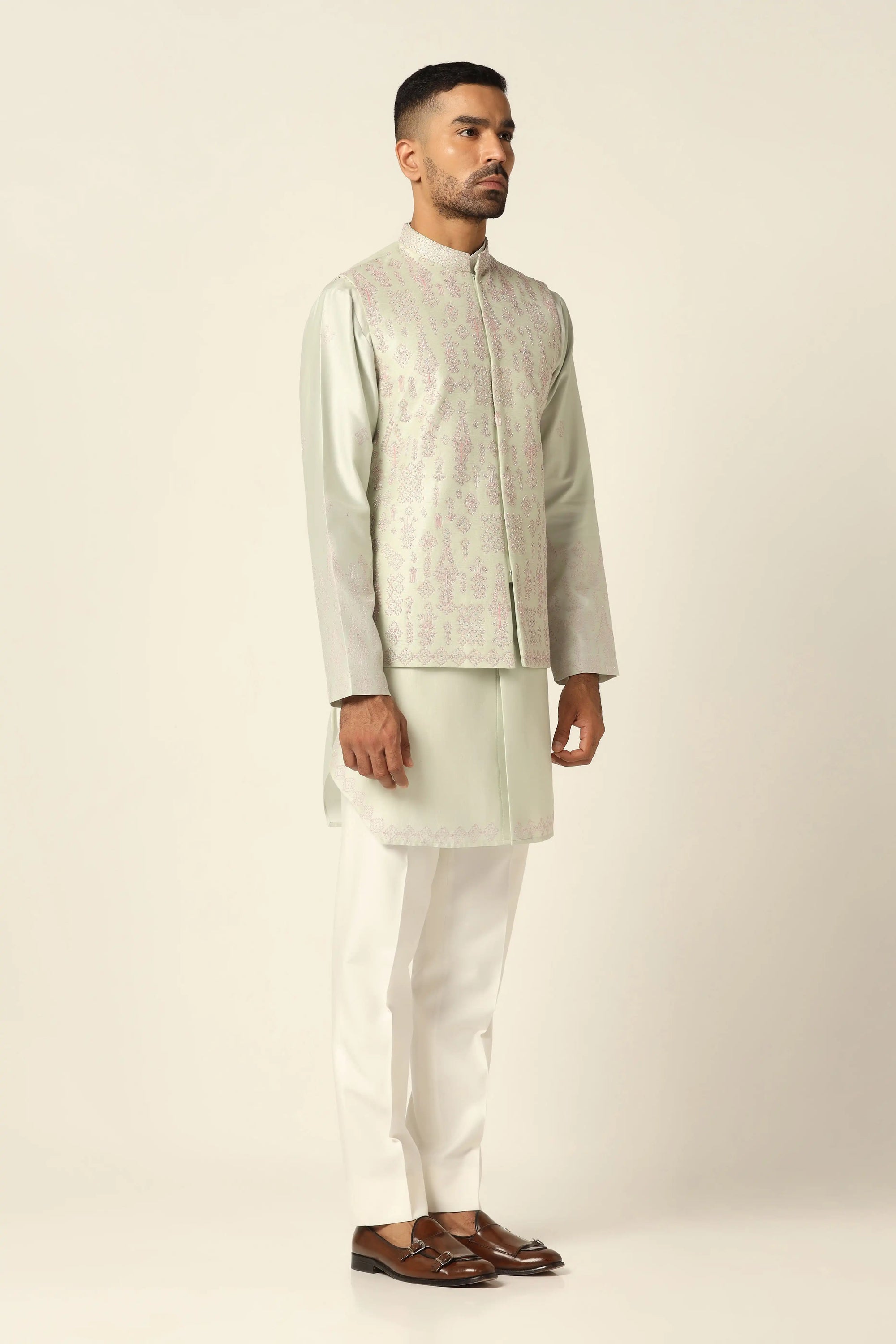Redefine style with the Green Nehru Set adorned with intricate mirror embroidery. Shop Now!