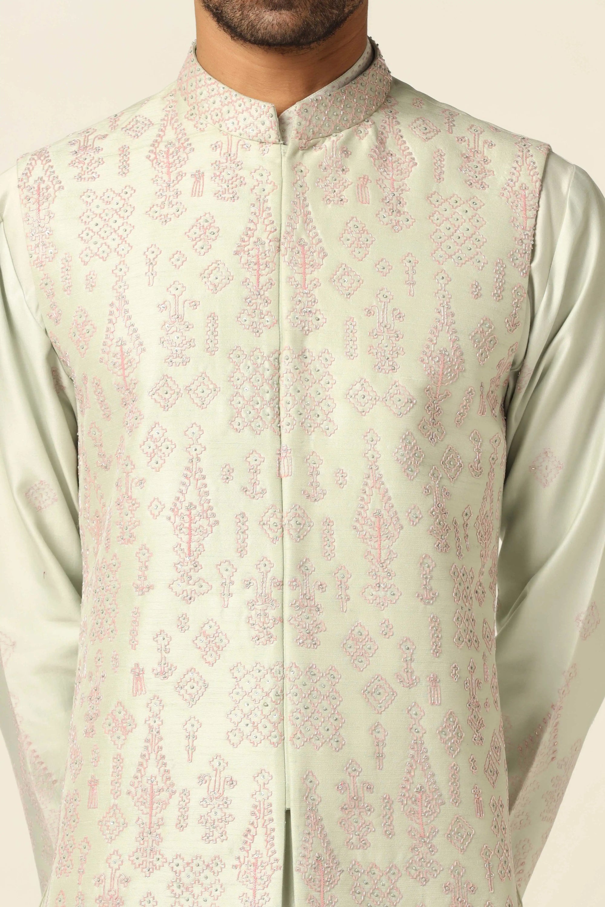 Redefine style with the Green Nehru Set adorned with intricate mirror embroidery. Shop Now!