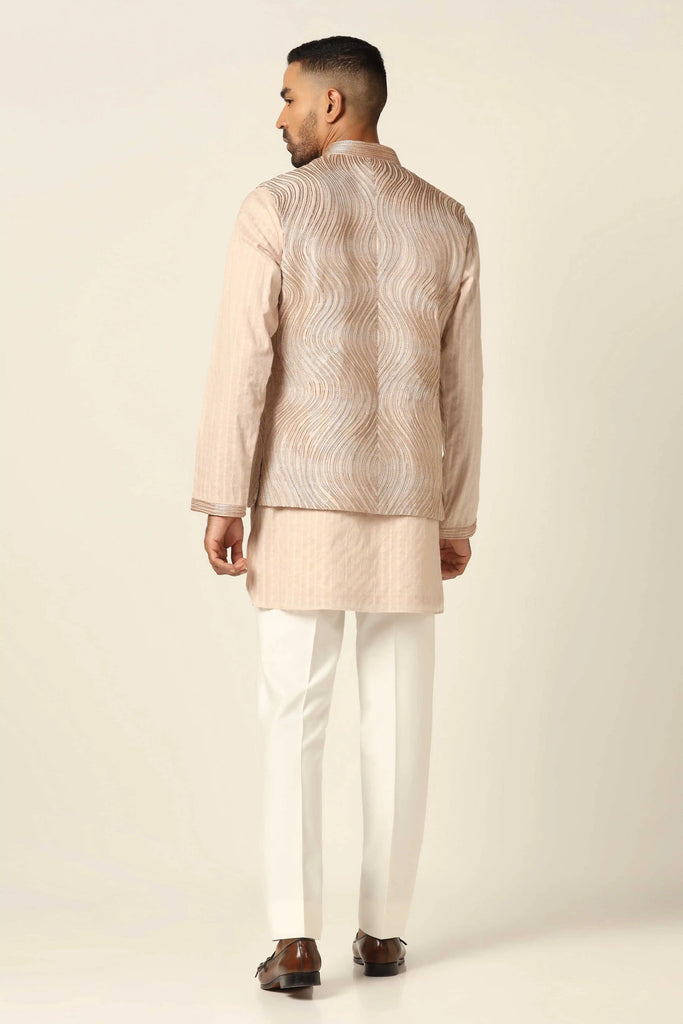 Elevate your ensemble with our Nehru Jacket set featuring meticulous machine & hand embroidery. Paired with matching kurta and white trousers for timeless sophistication.