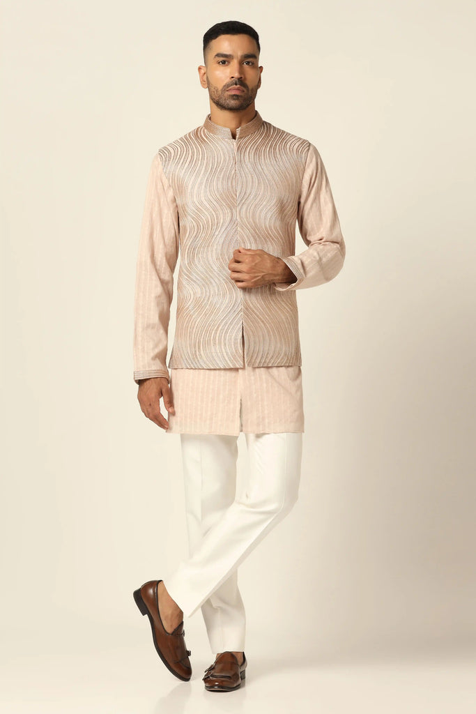 Elevate your ensemble with our Nehru Jacket set featuring meticulous machine & hand embroidery. Paired with matching kurta and white trousers for timeless sophistication.