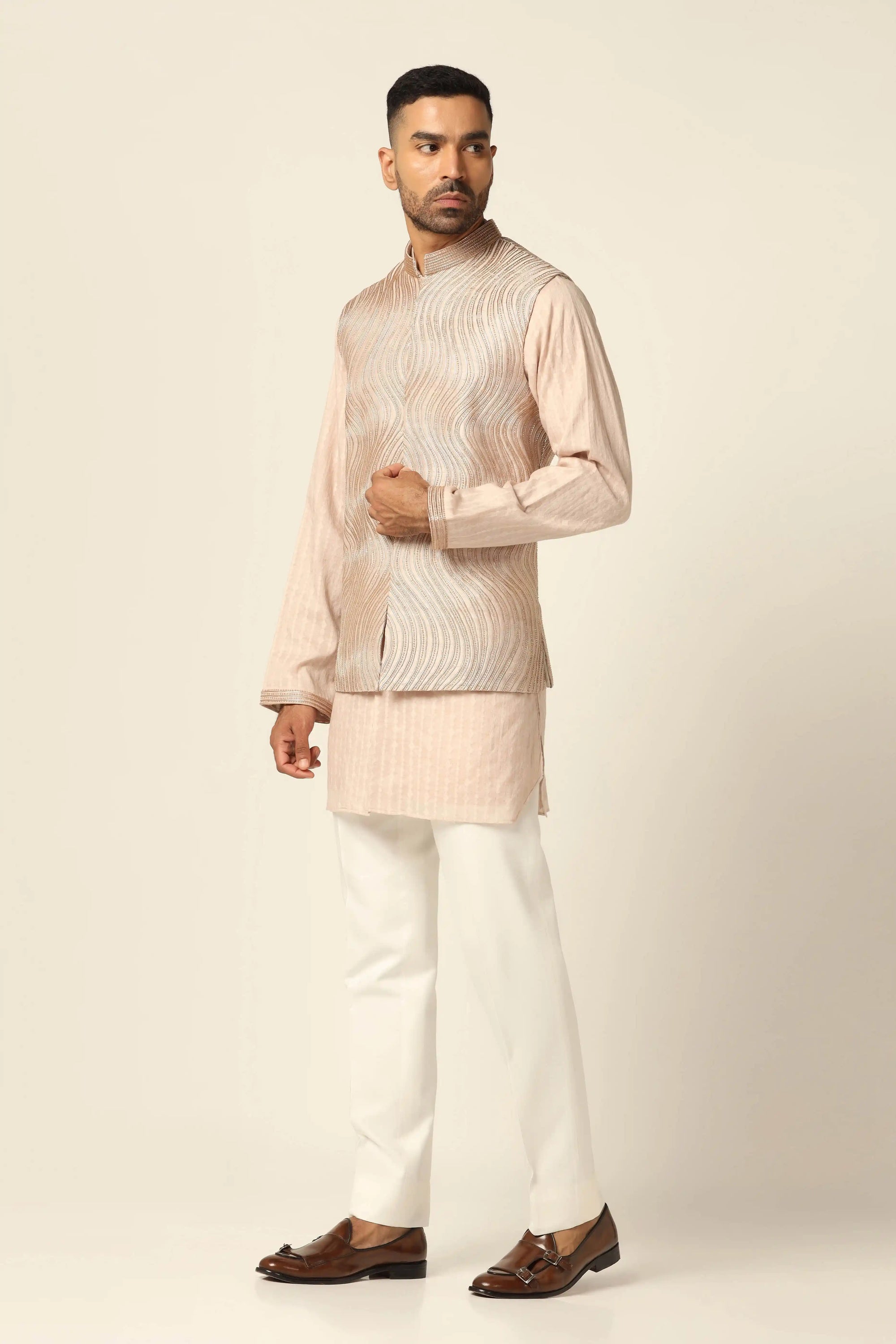 Experience elegance with the Peach Set and embroidered Nehru jacket. Shop Now!