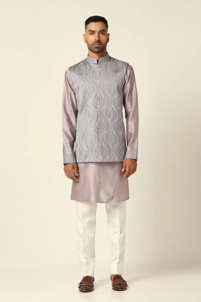 Elevate your style with our Nehru set featuring intricate thread embroidery on the jacket. Paired with a matching kurta and off-white trousers for timeless sophistication.
