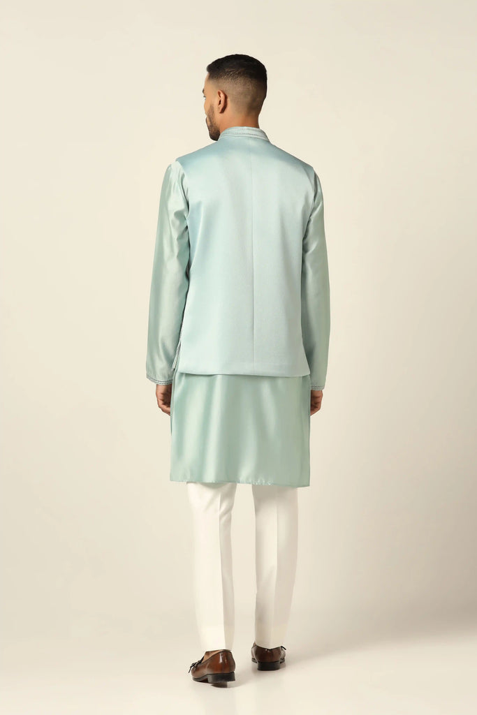 Embrace sophistication in our Nehru set adorned with delicate zigzag pintucks on the jacket front. Paired with a kurta and off-white trouser for timeless elegance.