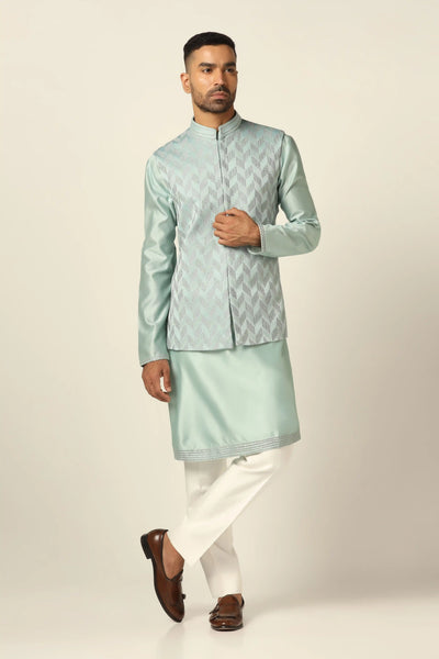 Embrace sophistication in our Nehru set adorned with delicate zigzag pintucks on the jacket front. Paired with a kurta and off-white trouser for timeless elegance.