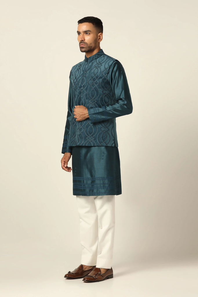 Indulge in luxury with our 100% cotton velvet Nehru set. Featuring intricate thread embroidery on the jacket, paired with a matching Kurta and off-white trouser for timeless style.
