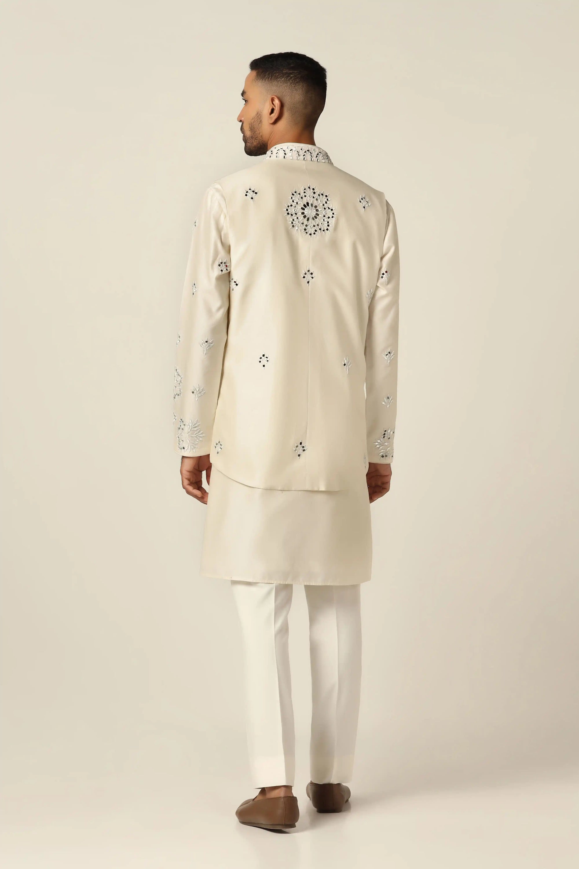 Timeless and elegant, the Off-White Set with Nehru embroidery is perfect for any occasion. Shop now!