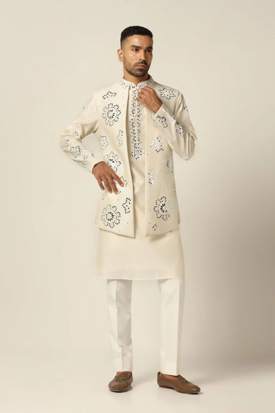 Embrace elegance with our Nehru set adorned in floral mirror work embroidery. The kurta features matching mirror work, paired with an off-white Trouser for timeless sophistication.