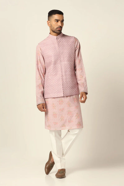 Elevate your ensemble with our Peach Nehru Jacket adorned with subtle geometric thread and pearl embroidery. Paired with a blocked printed Kurta and off-white pajamas for refined elegance.