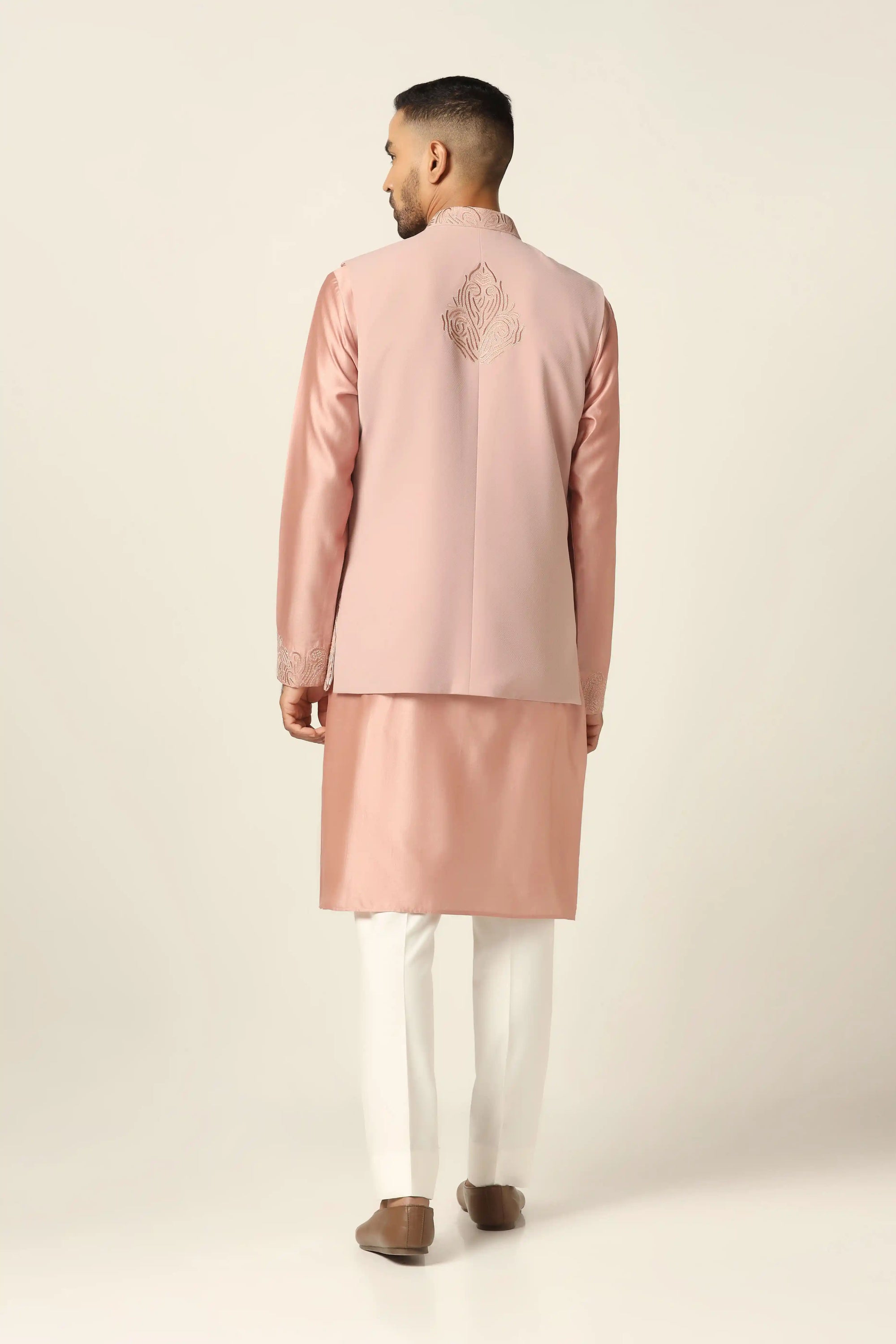 Sophisticated and stylish, the Peach Embroidered Nehru Set is perfect for special moments. Shop now!