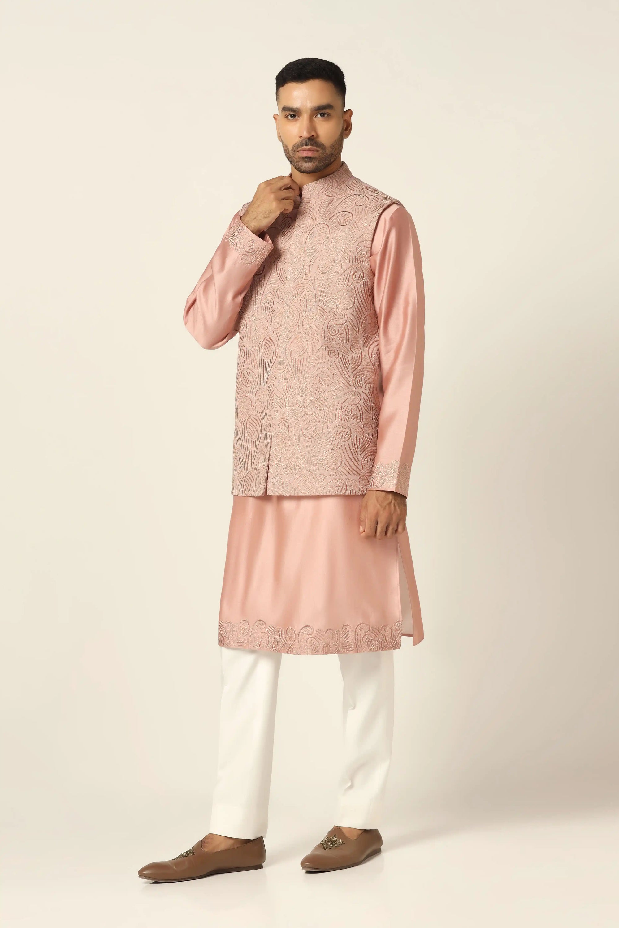 Sophisticated and stylish, the Peach Embroidered Nehru Set is perfect for special moments. Shop now!