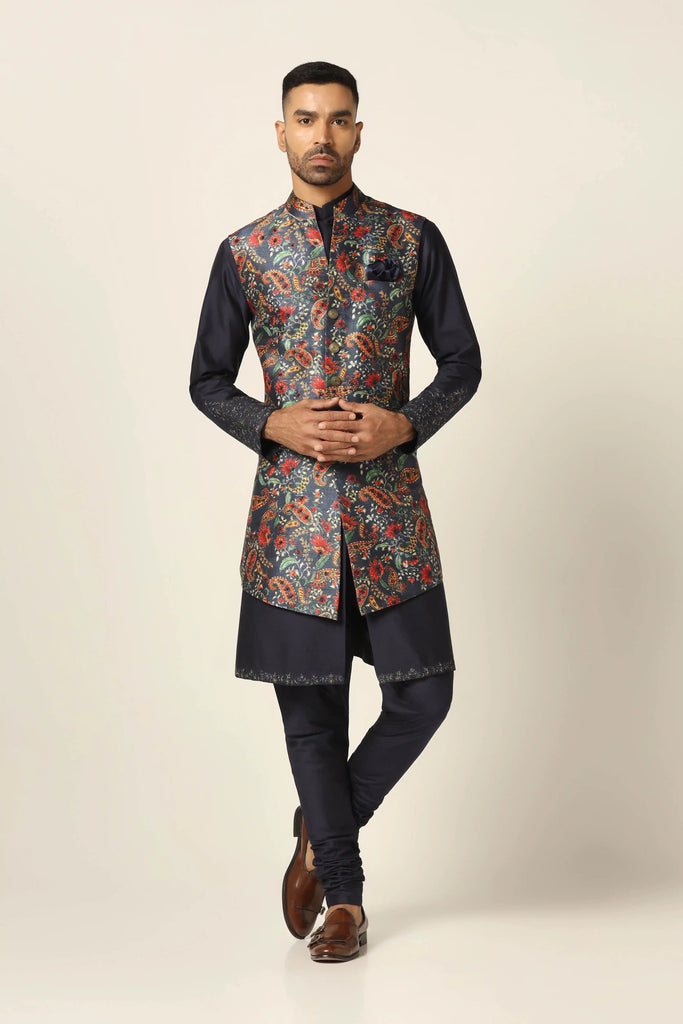 Elevate your ethnic style with our Nehru set featuring intricate floral embroidery. Paired with a navy Kurta and matching pajama for a timeless look.