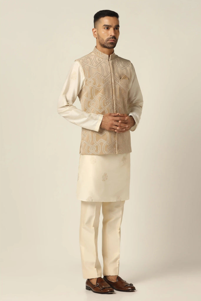 Immerse in elegance with our Nehru set, featuring machine & hand embroidery. Paired with a matching Kurta and off-white trousers for timeless sophistication.