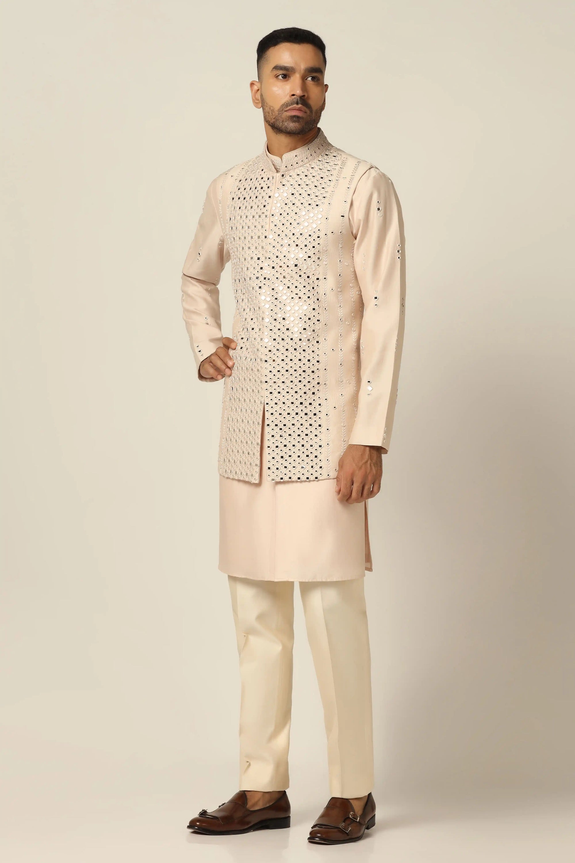 Add elegance to your wardrobe with the Peach Embroidered Nehru Set. Shop now!