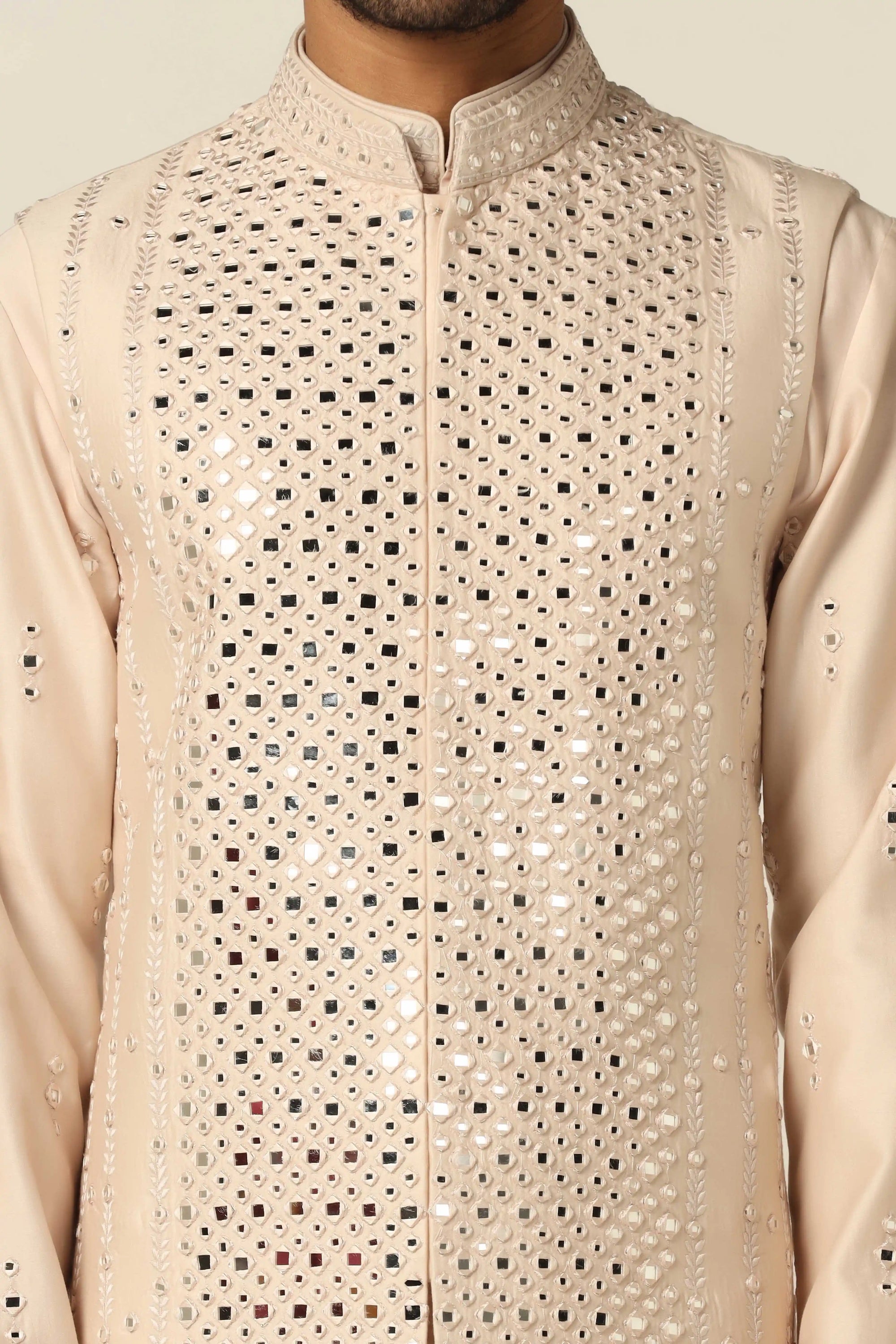 Add elegance to your wardrobe with the Peach Embroidered Nehru Set. Shop now!