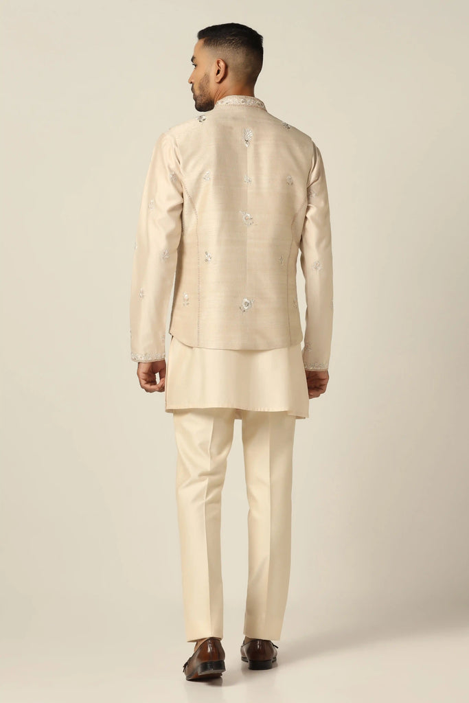 Elevate your ensemble with our Nehru jacket set featuring meticulous machine & hand embroidery. Paired with a matching kurta and trousers for timeless elegance.