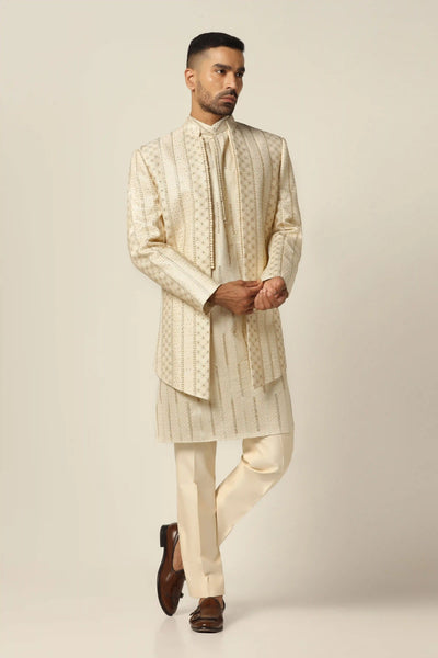 Draped in raw silk, our Indo-western set dazzles with tonal embroidery. Paired flawlessly with a matching kurta for a refined ensemble.